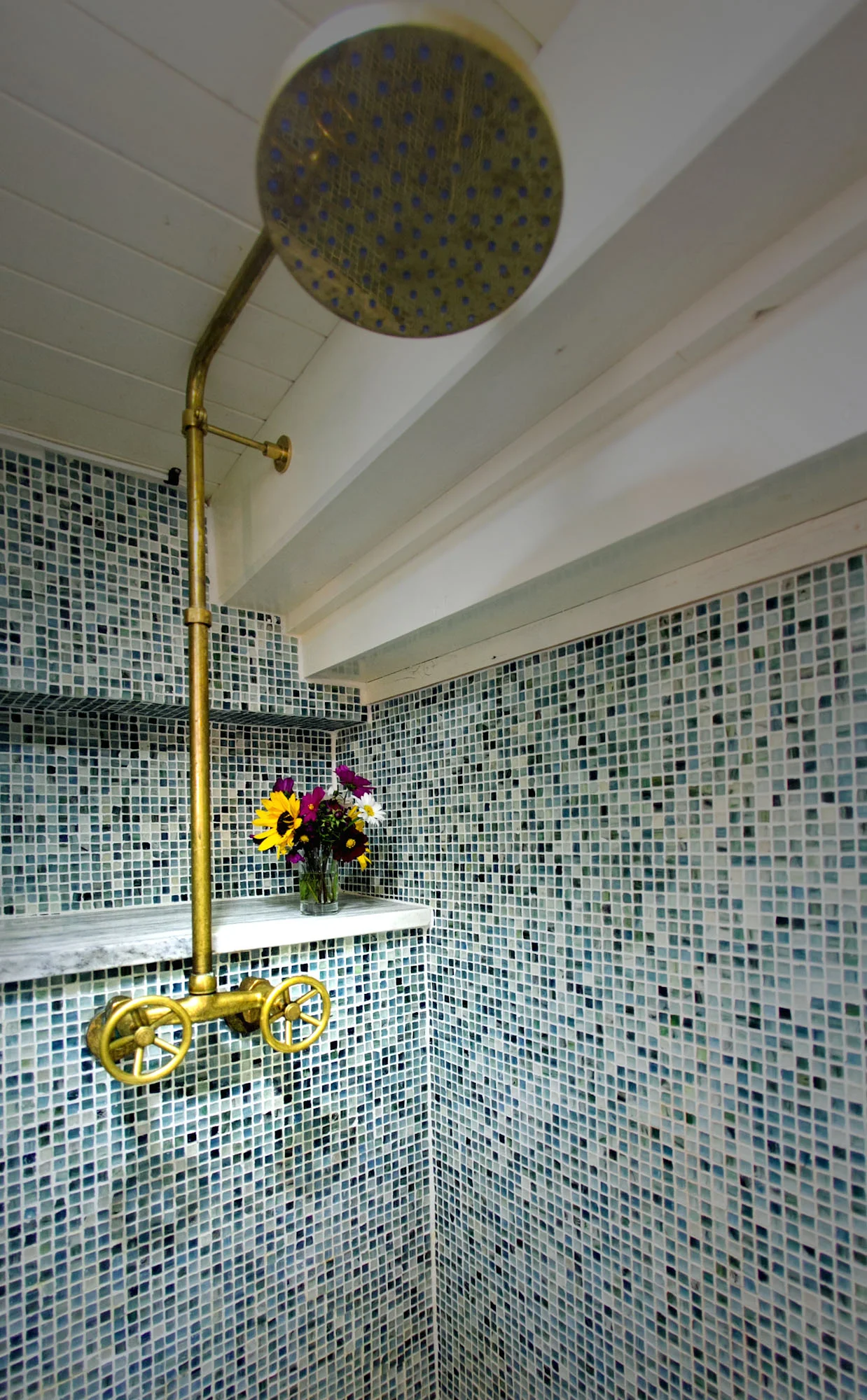 Showers are outfitted with rainshower heads. Photo: Nadra Edgerley