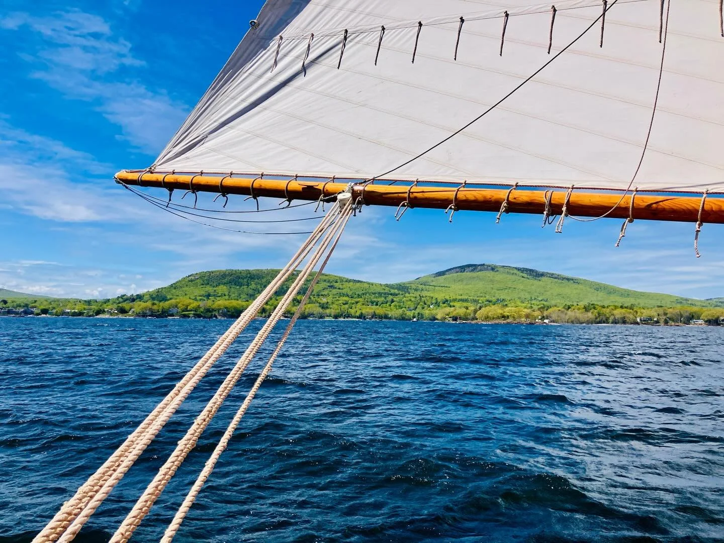As the snow begins to fly, we can&rsquo;t help but begin to reminisce on another amazing summer here in Penobscot Bay. Thanks to all of our guests who helped make it so fabulous! Pictured here are the Camden Hills as we sail past 🌞 #sailmaine #woode
