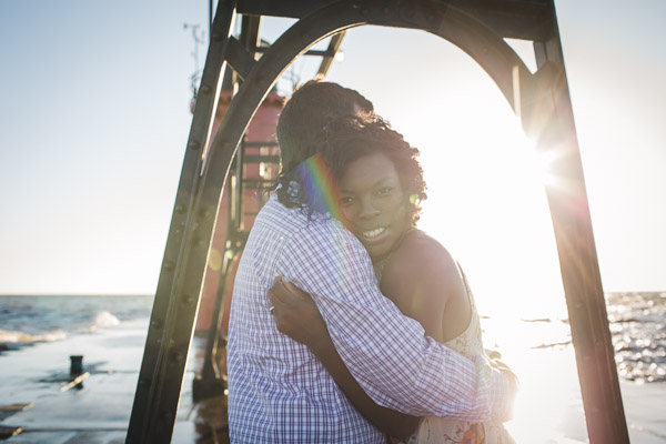 couple hugging on pier, connection, embrace, warmth