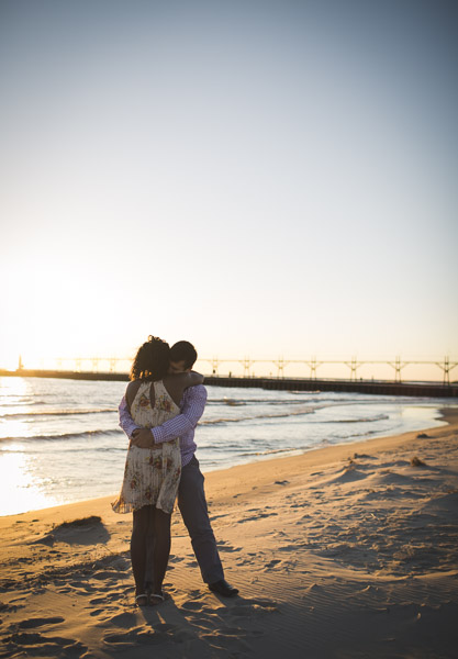 warm embrace of couple on sand at beach 