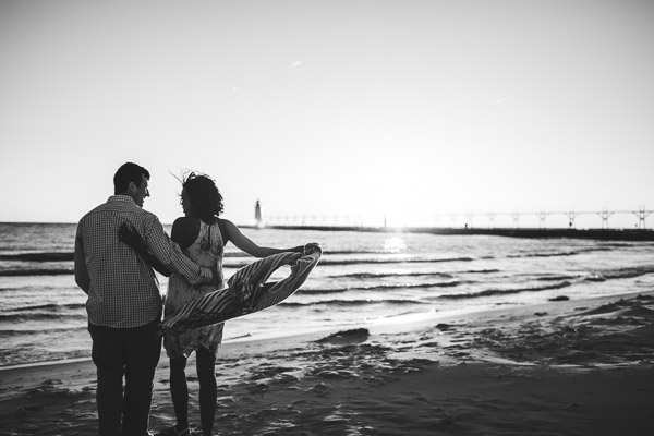 couple dancing on beach with scarf creating beautiful movement, black and white 