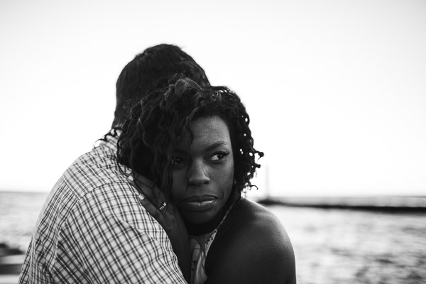 Intimate portrait of couple on beach, black and white, connection, raw, powerful