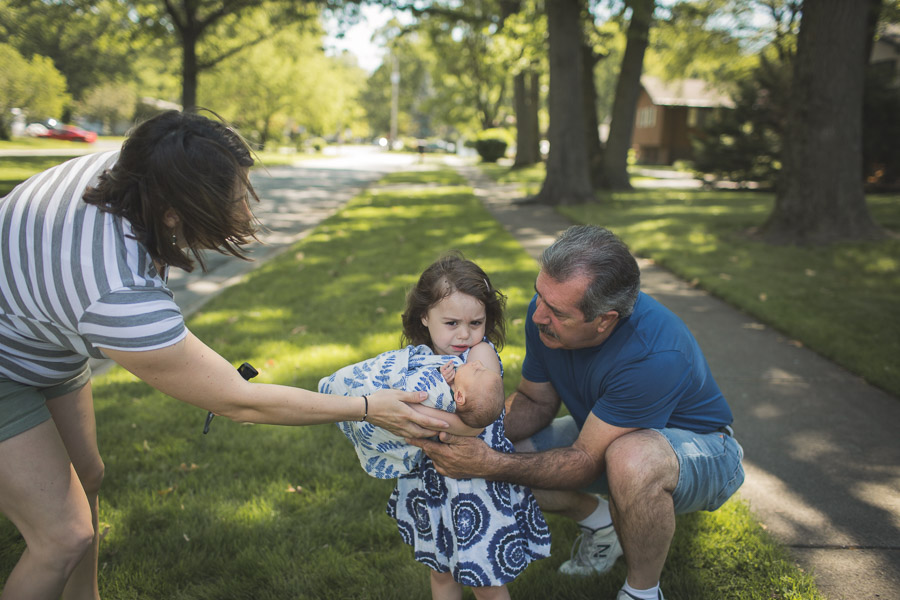 documentary, older sister holding baby sister  nested in trees 