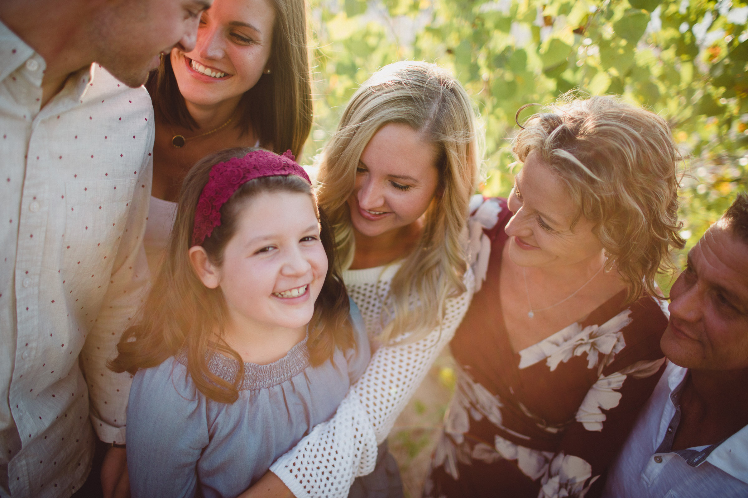 overhead shot of family laughing together in gorgeous light 