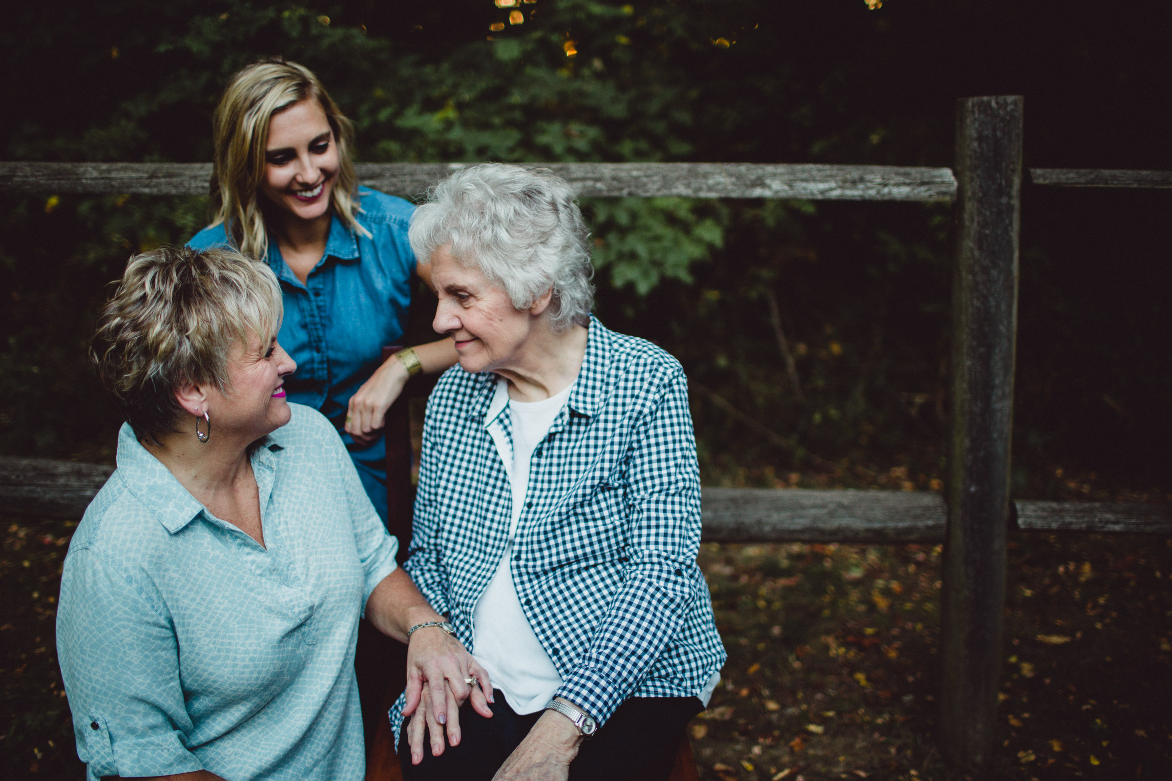 3 women smiling richly a one another 