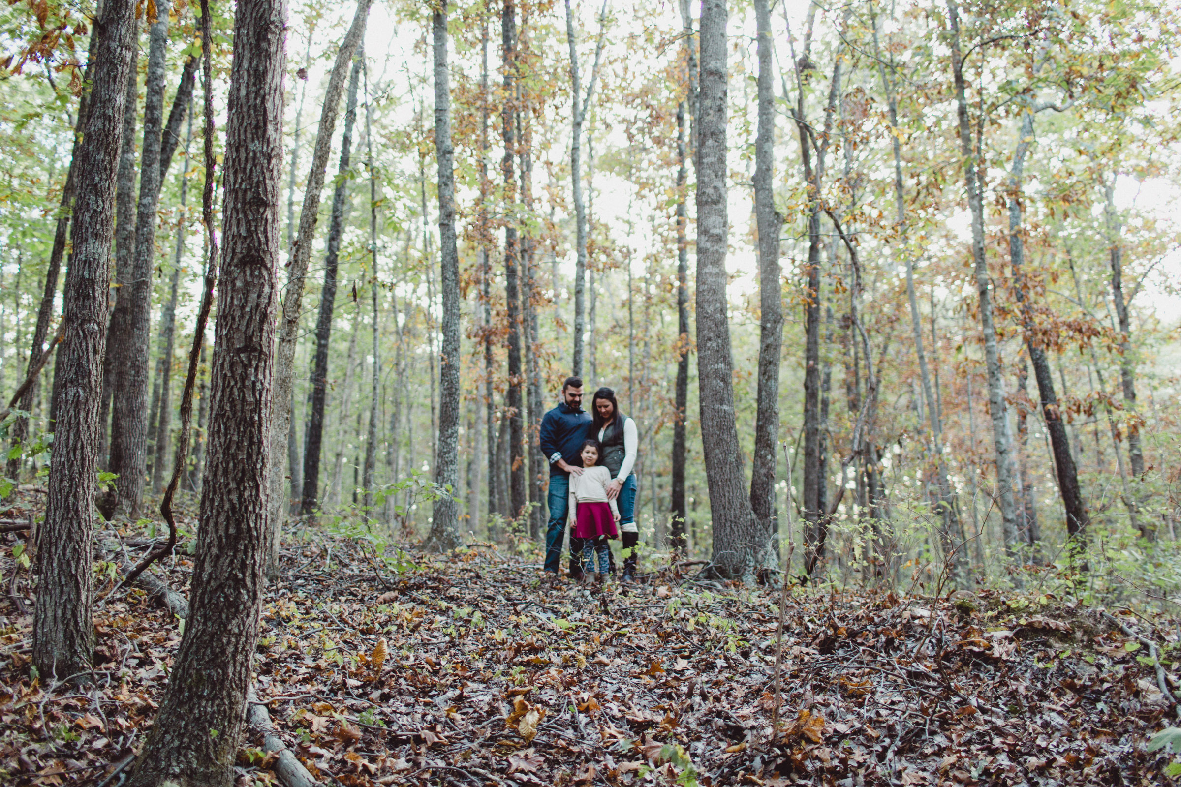 family connecting in the woods 