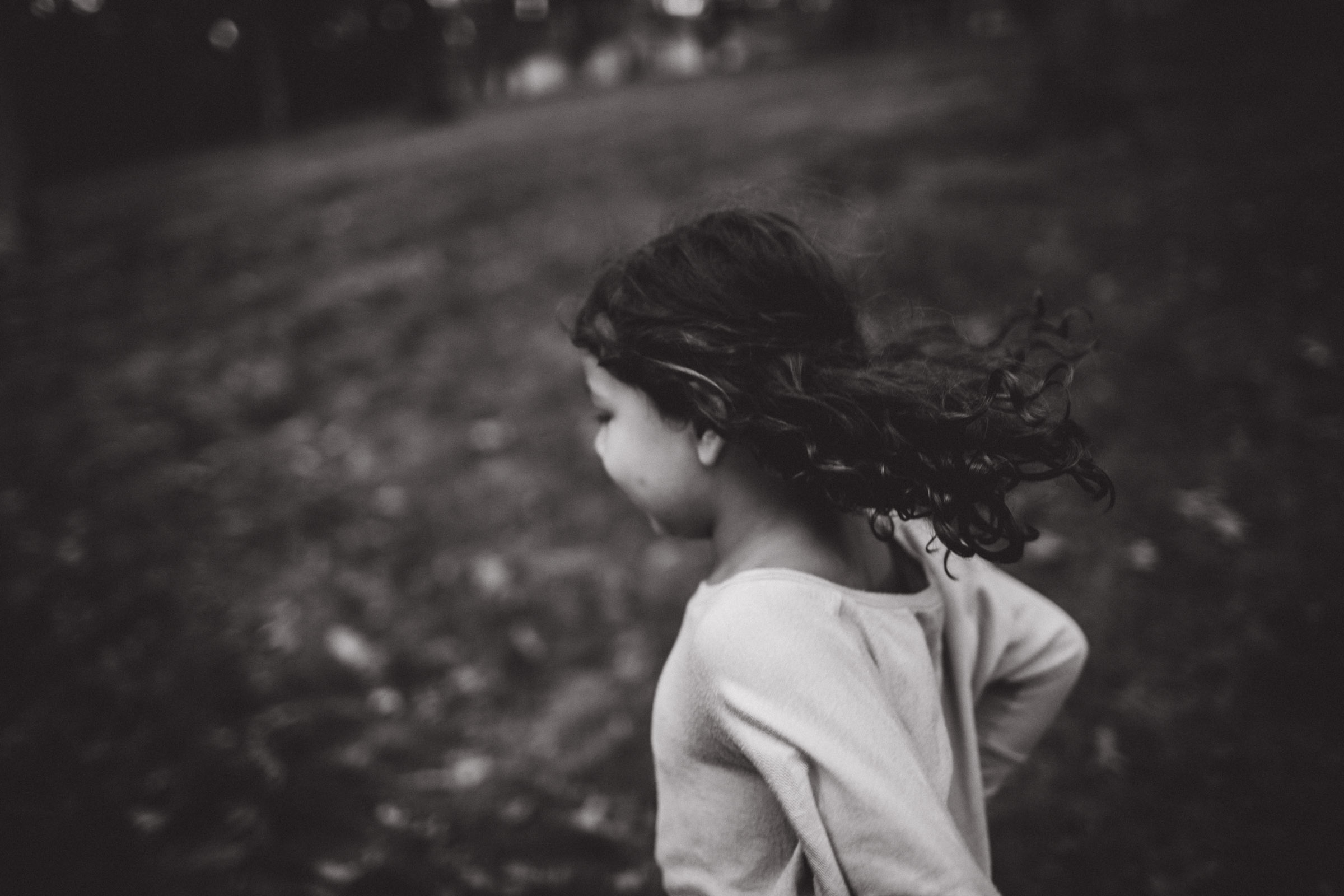 girl running through the woods