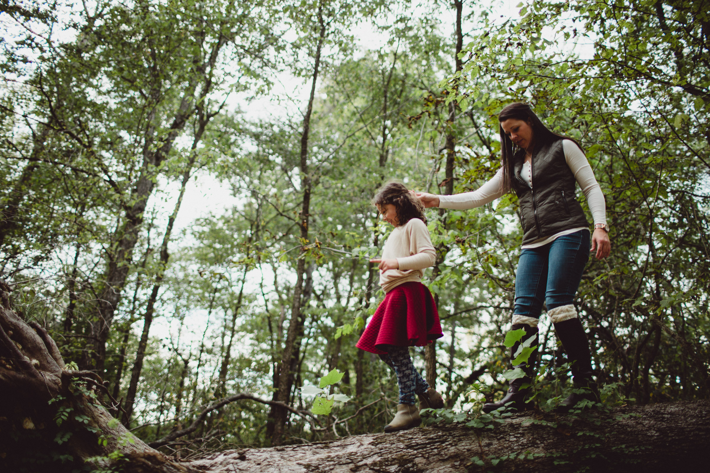 exploring on a log with mom