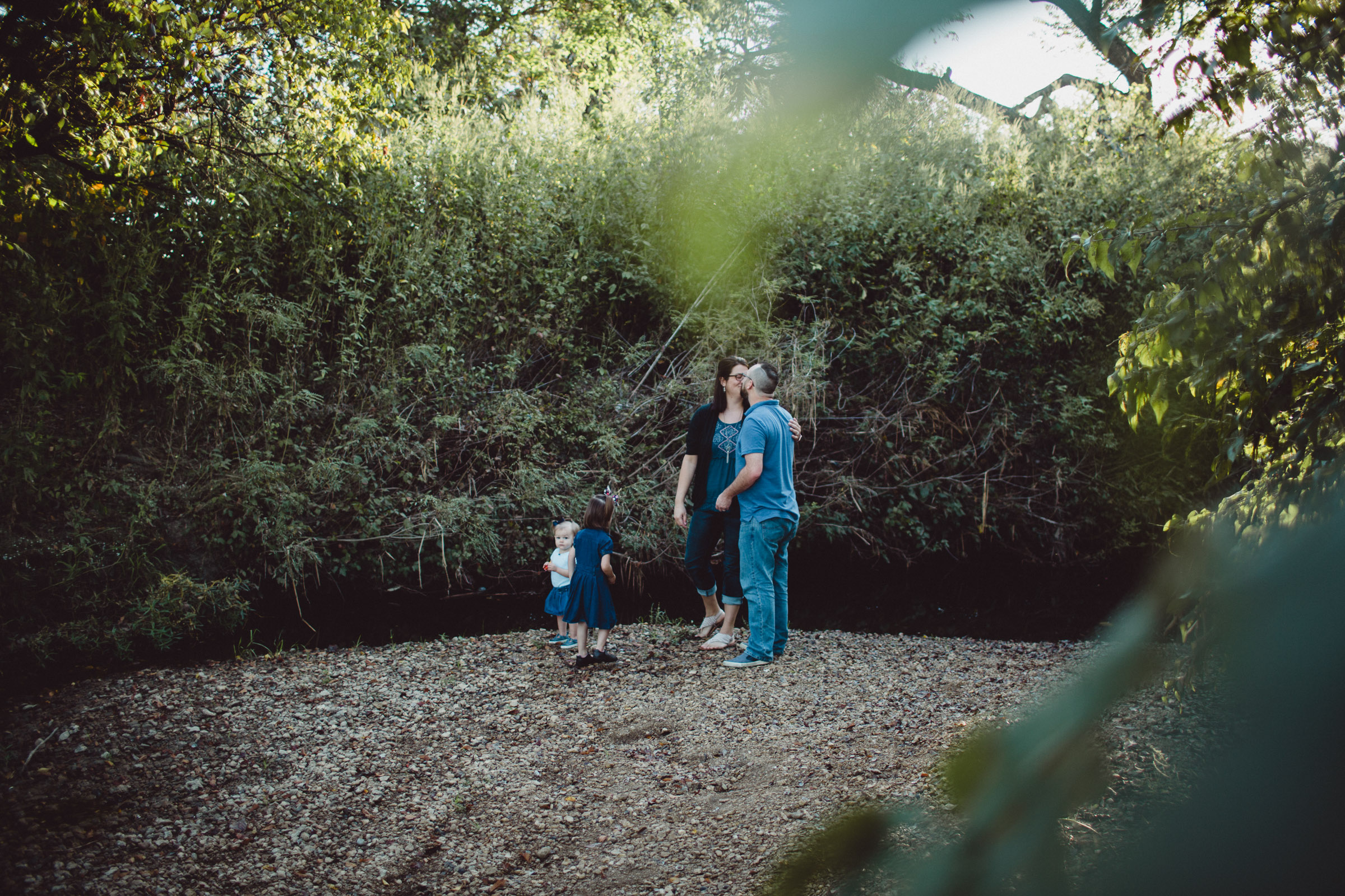 Image of family playing by the creek 