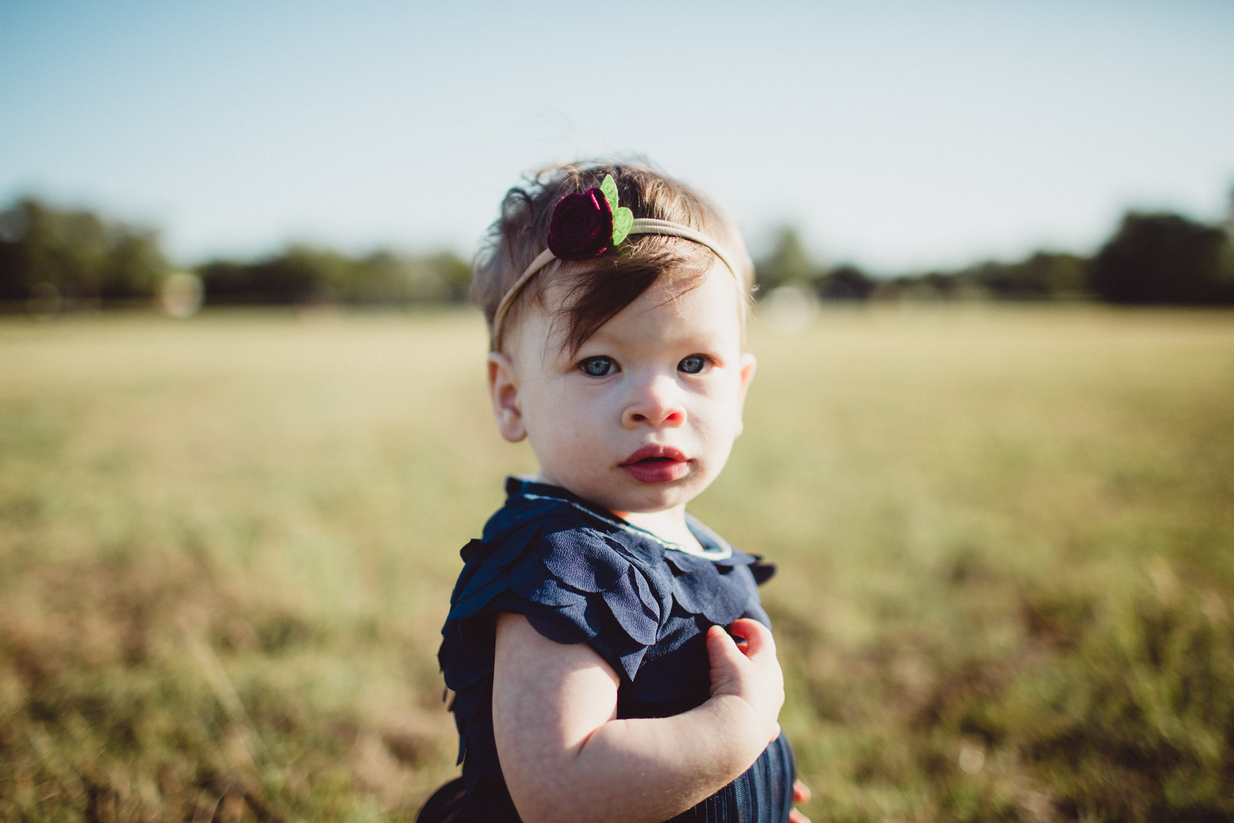 Portrait of toddler girl looking straight into camera 