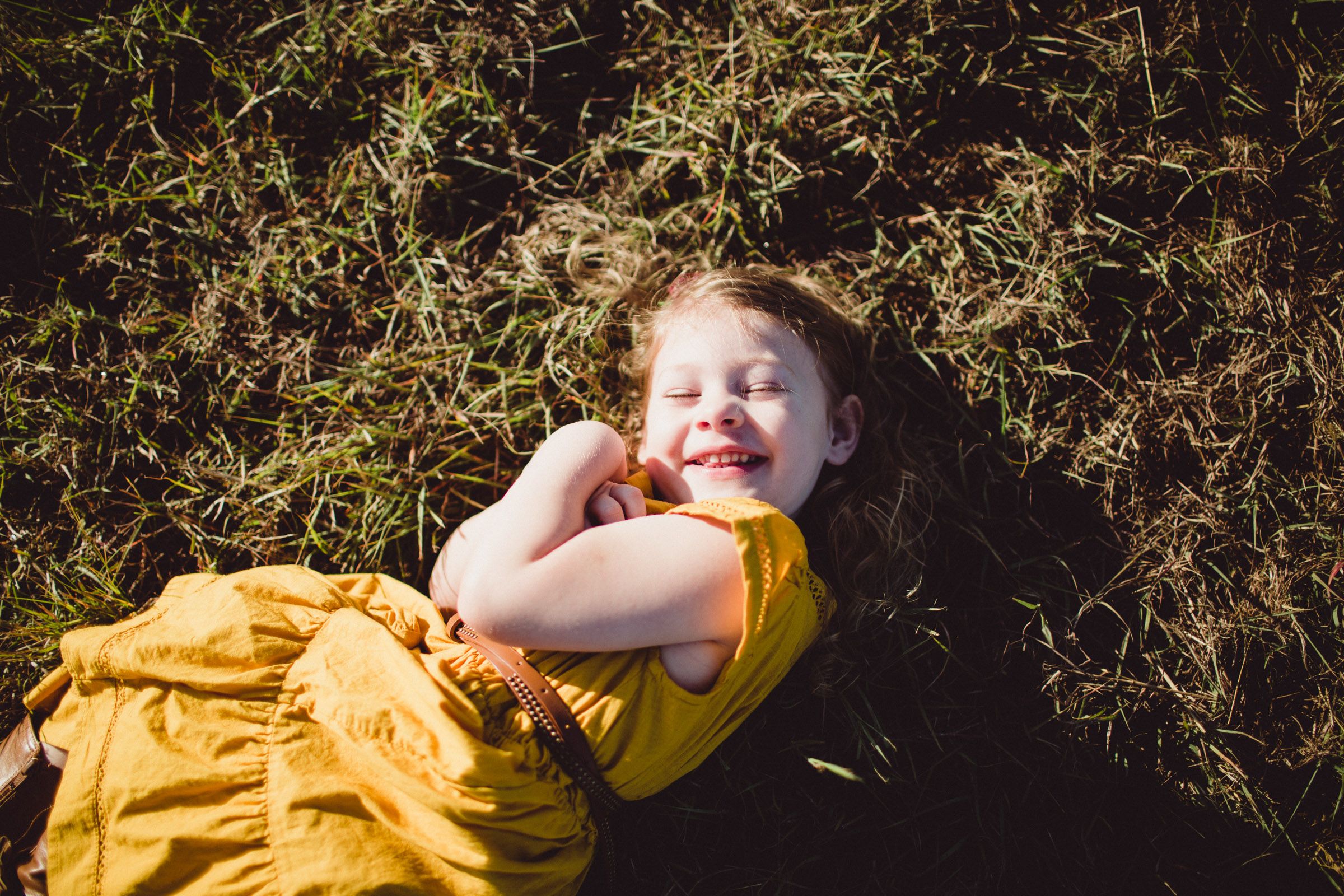 joy of little girl, overhead shot of laughter 