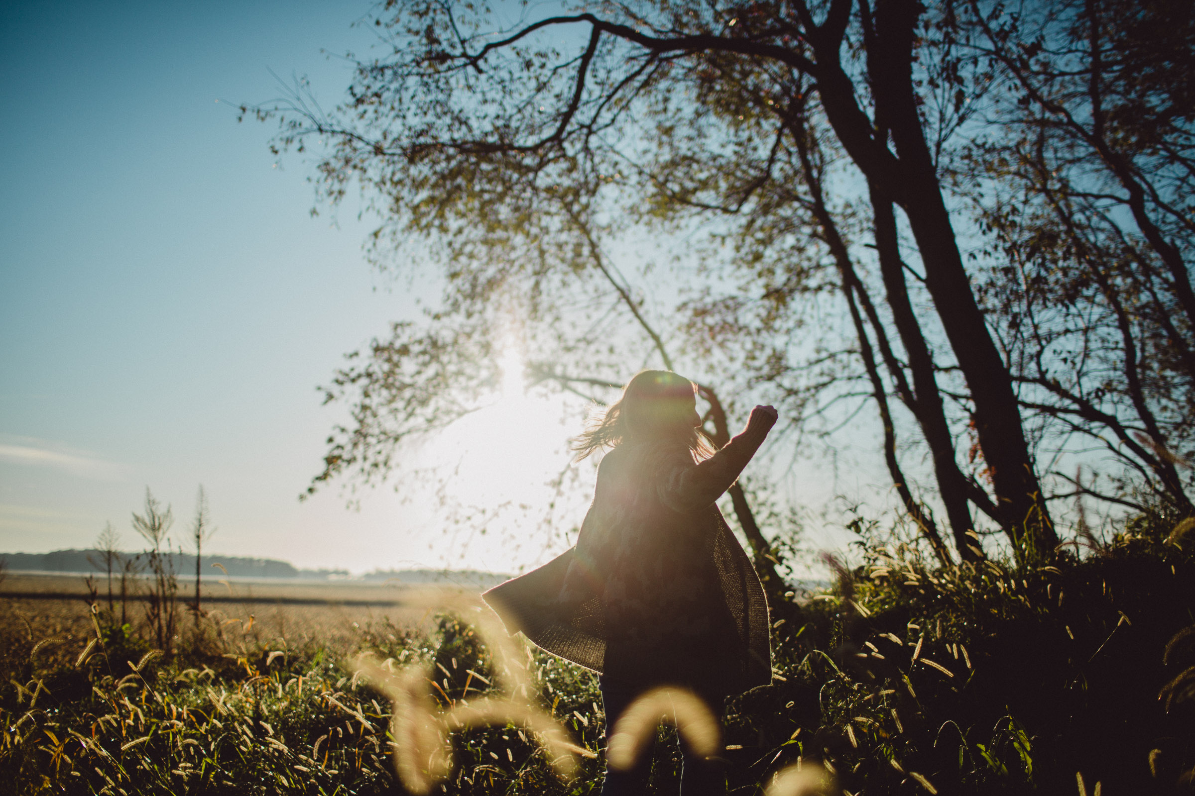 Girl Dancing in Joy in a cornfield 