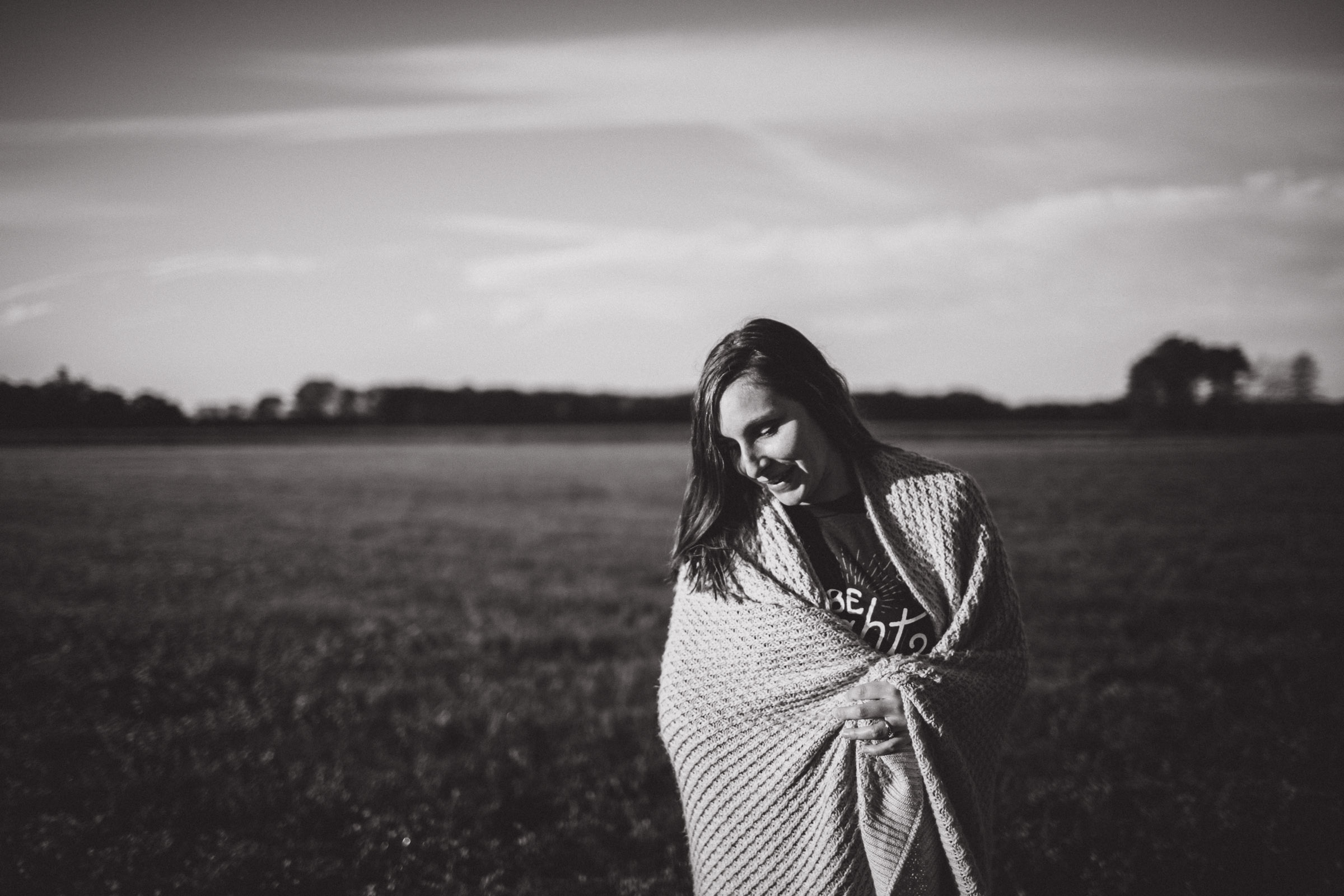 Portrait of girl looking down with moody die light and black and white