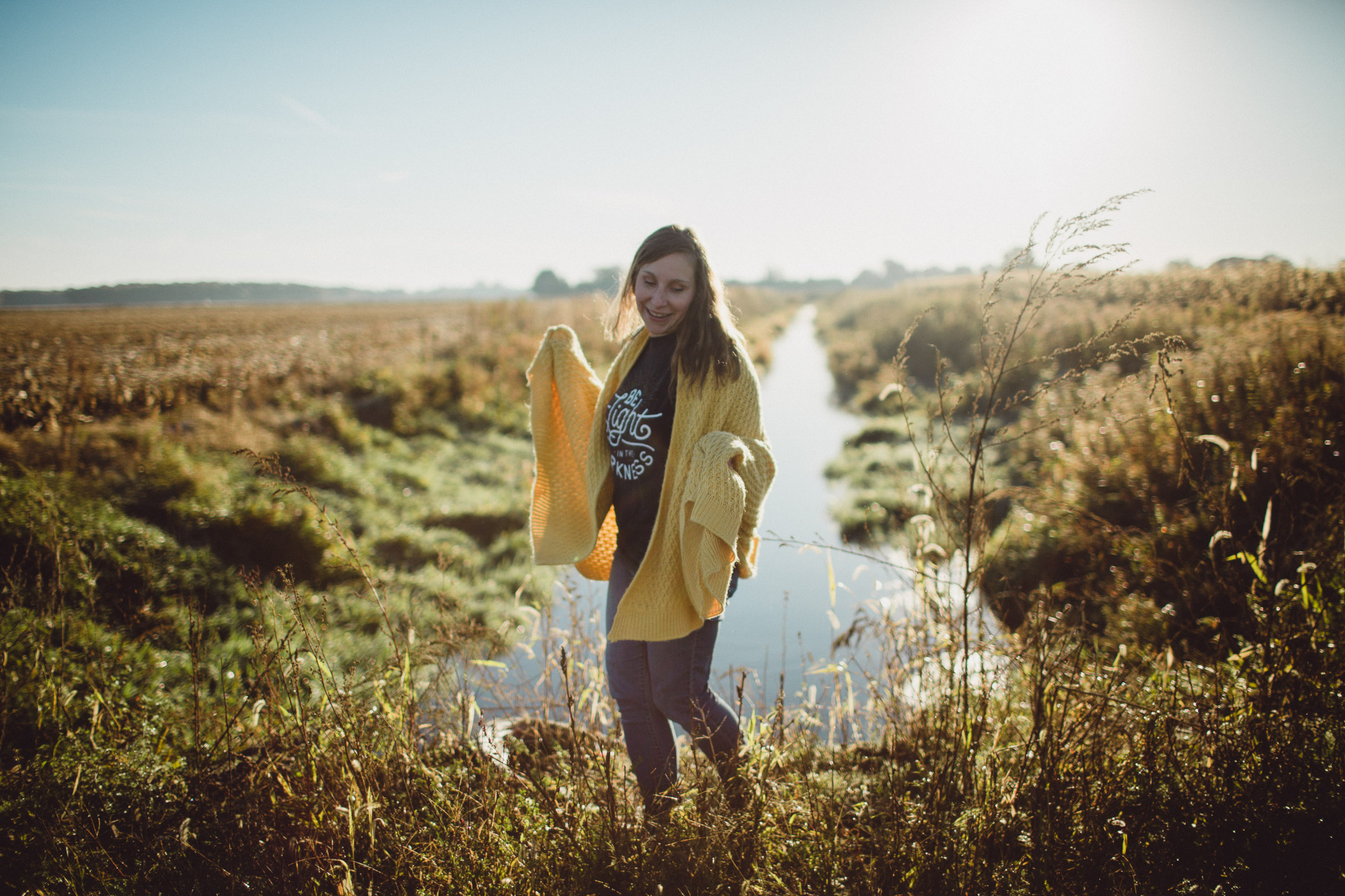 Girl Dancing in front of creek; joy overflowing 