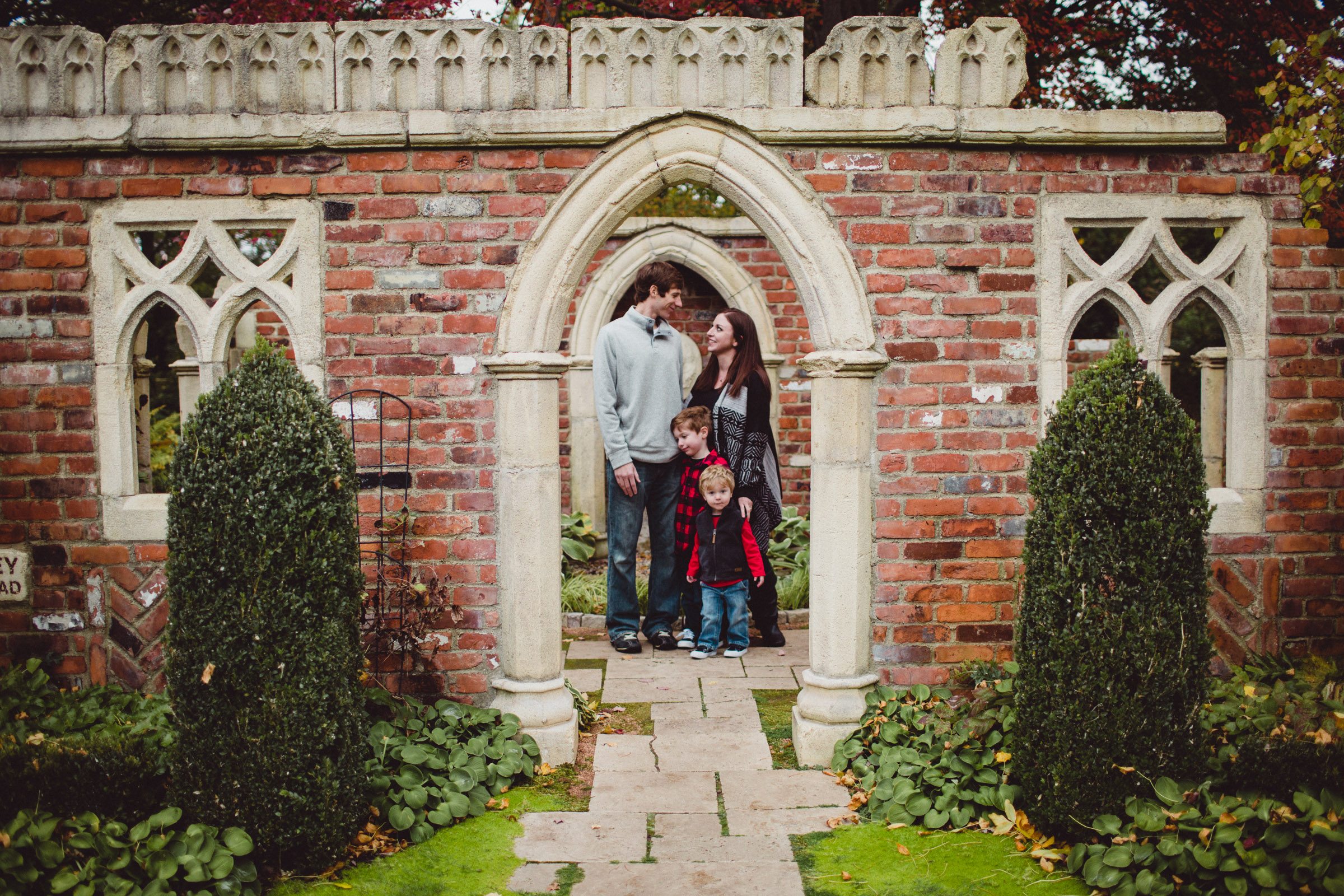 Family composite image framed under archway