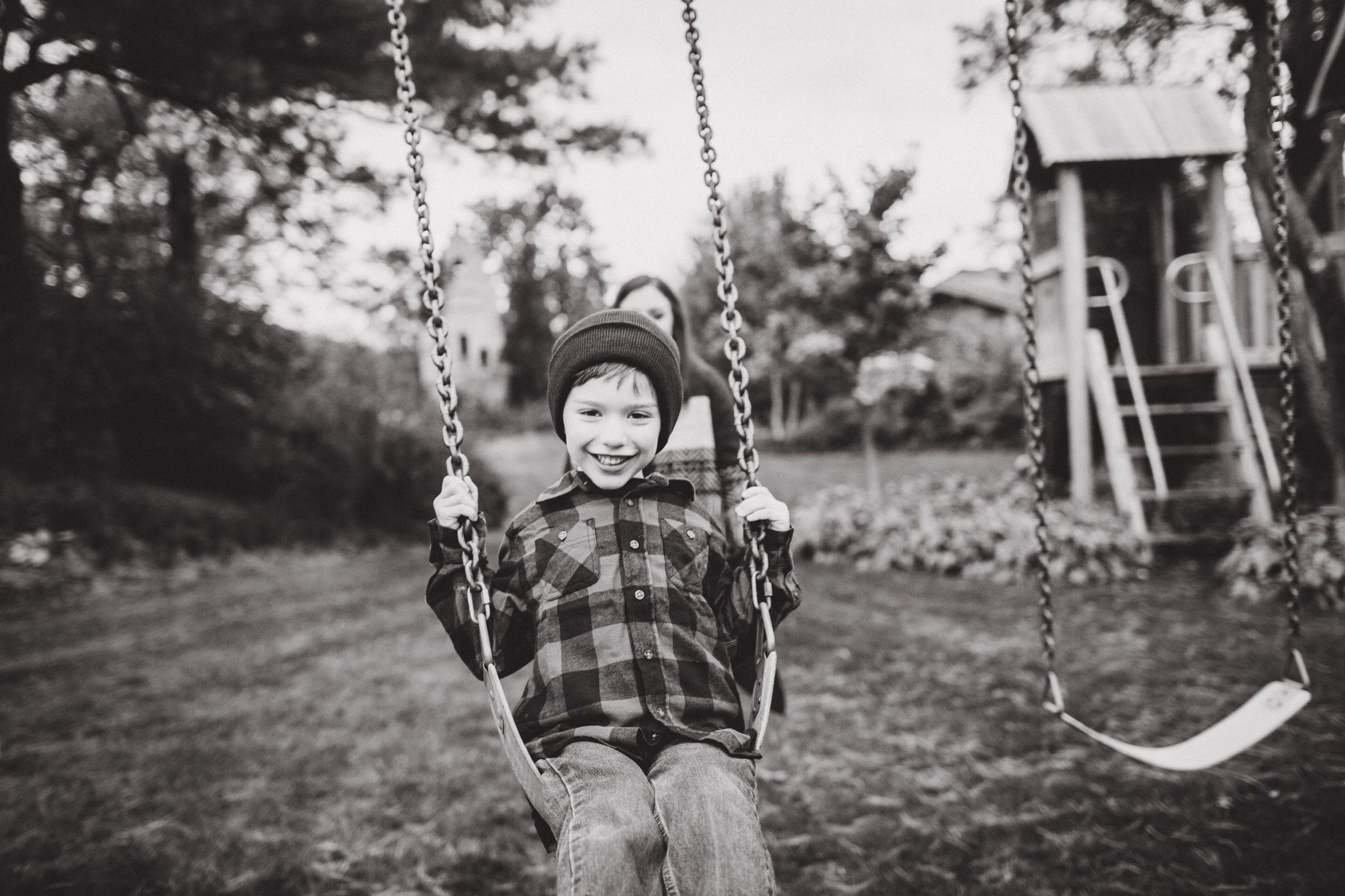 little boy on swings