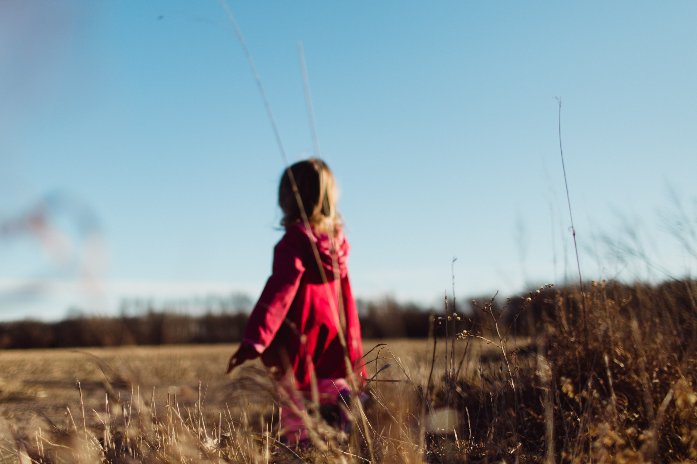 girl walking into the open plains