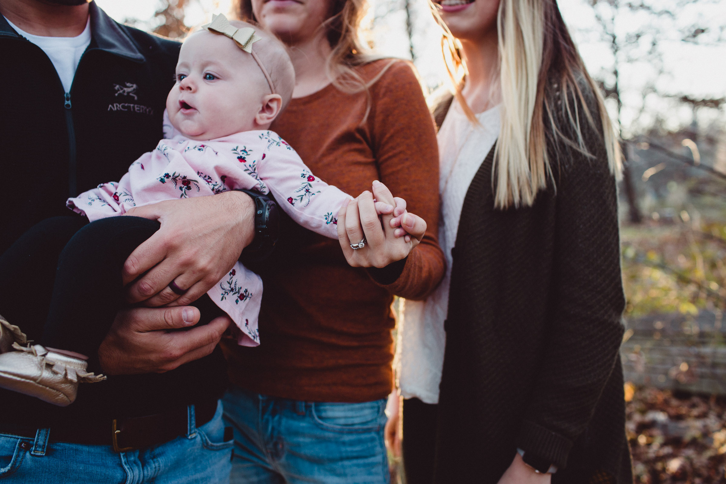 mother holding childs hand
