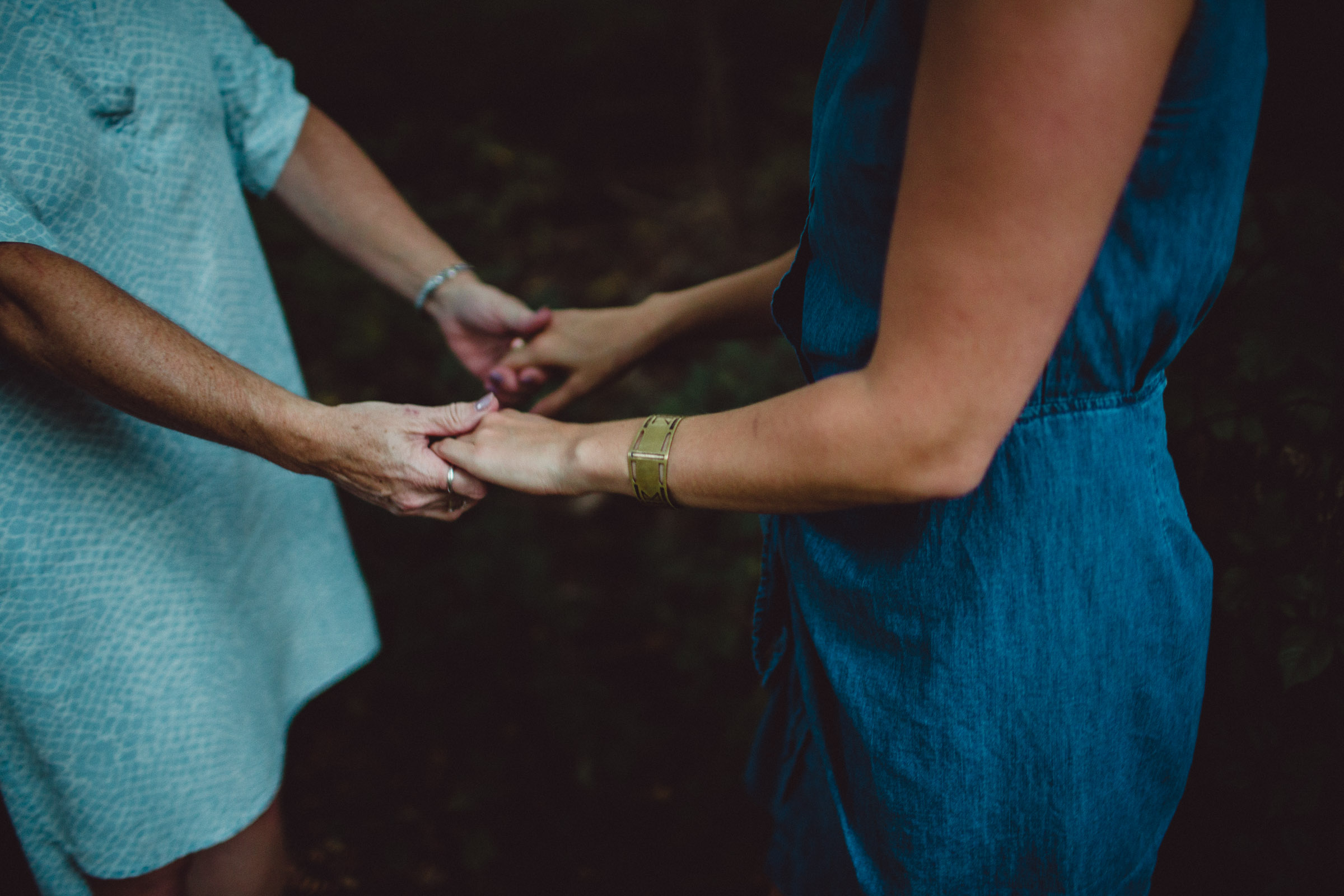 Mother and daughter holding hands 