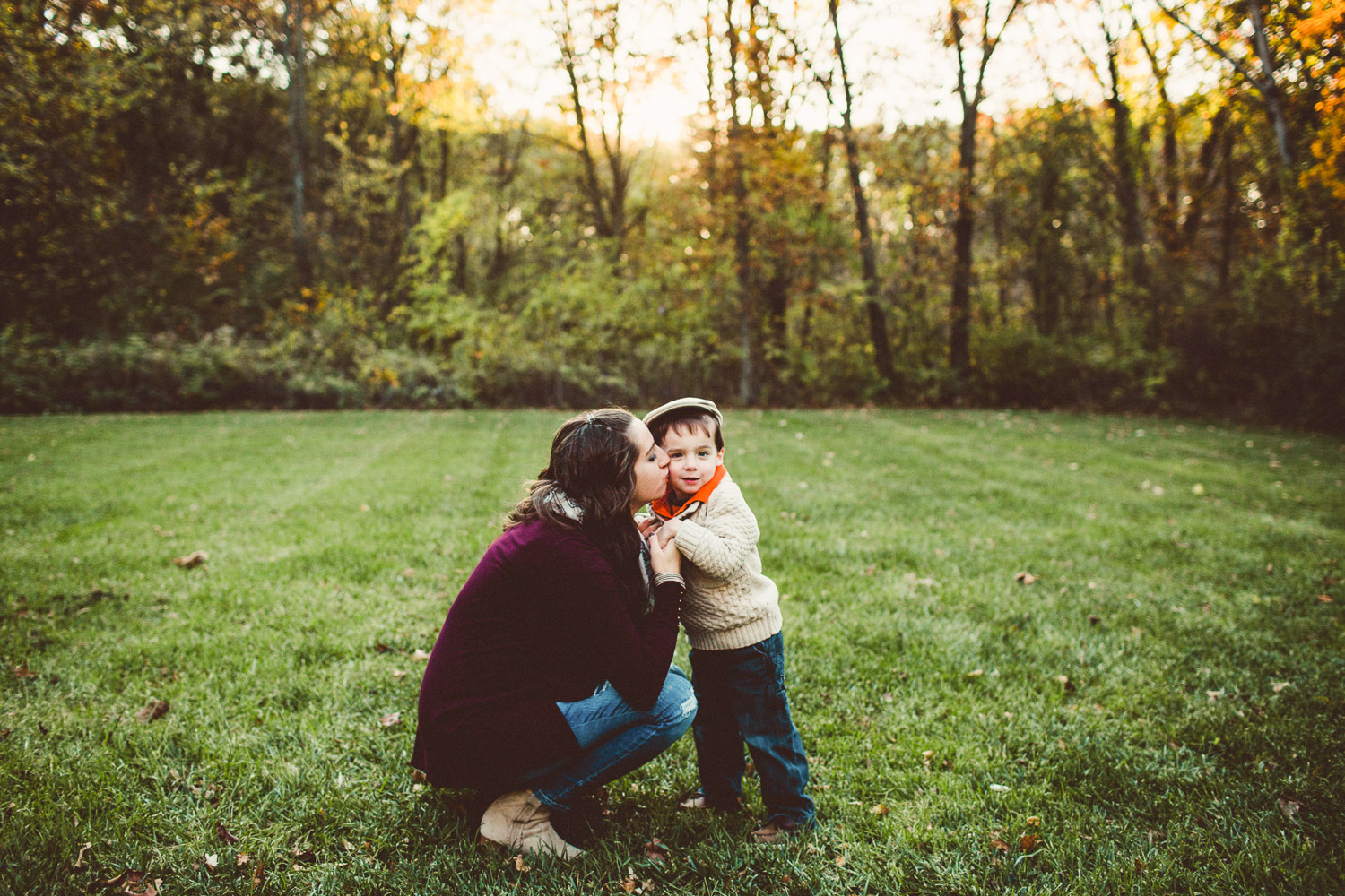 Mother leaning in to Kiss son