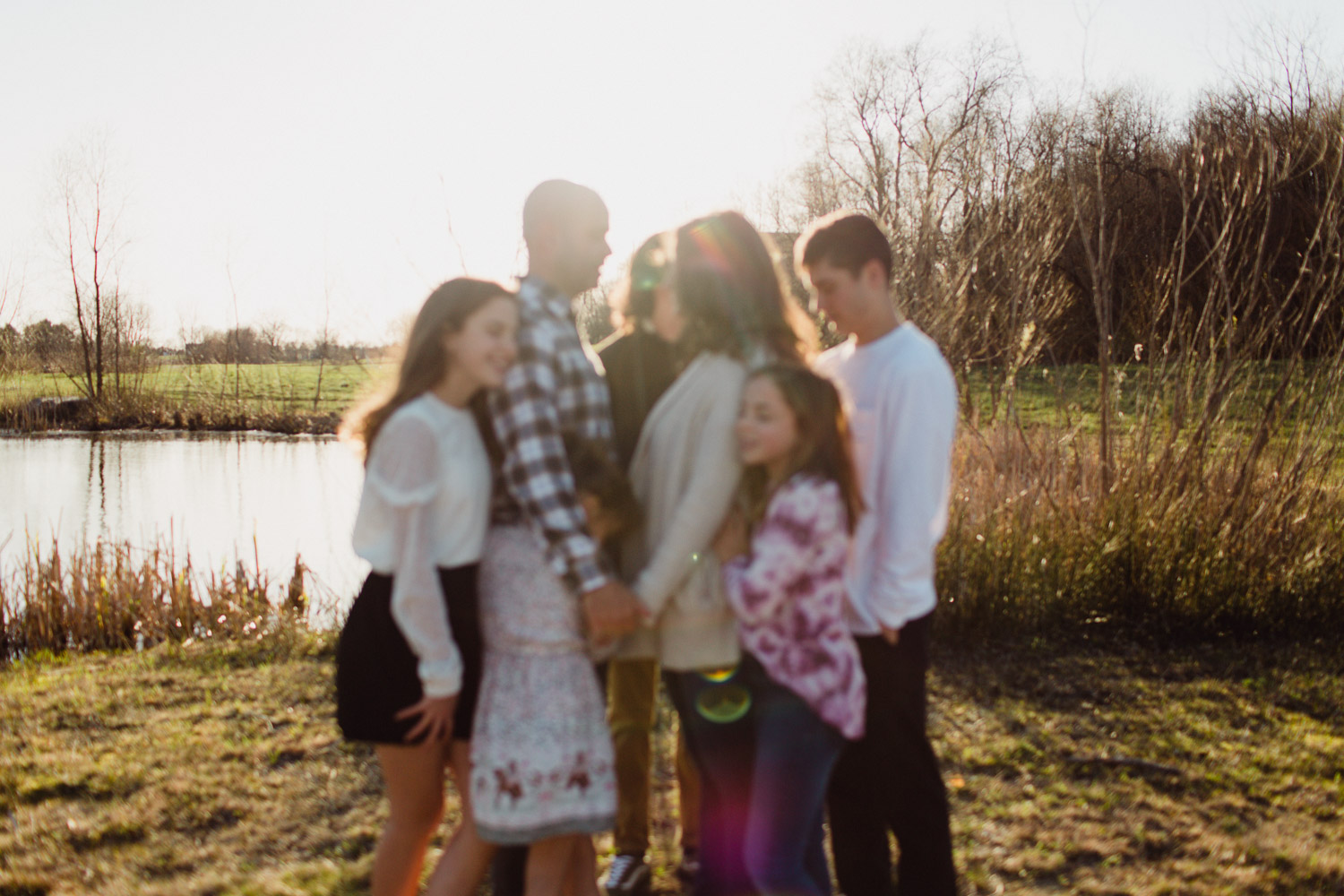 Family held together in evening light 