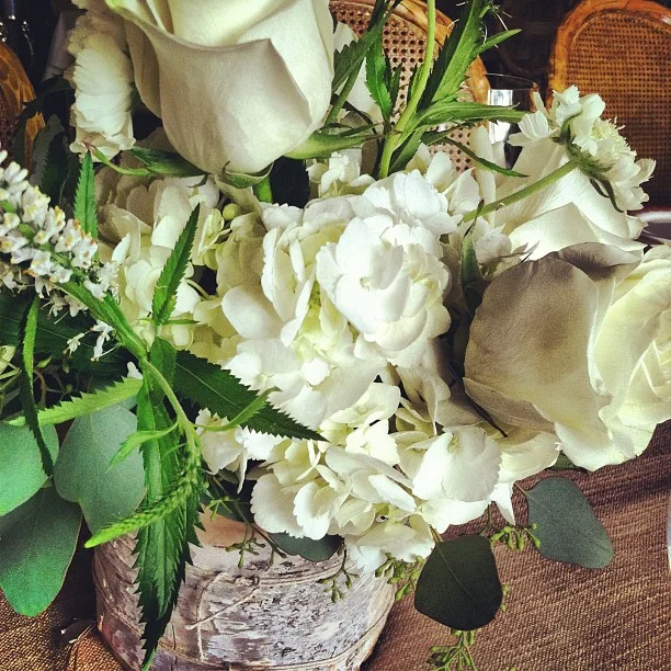 Centerpieces wrapped in birch bark.