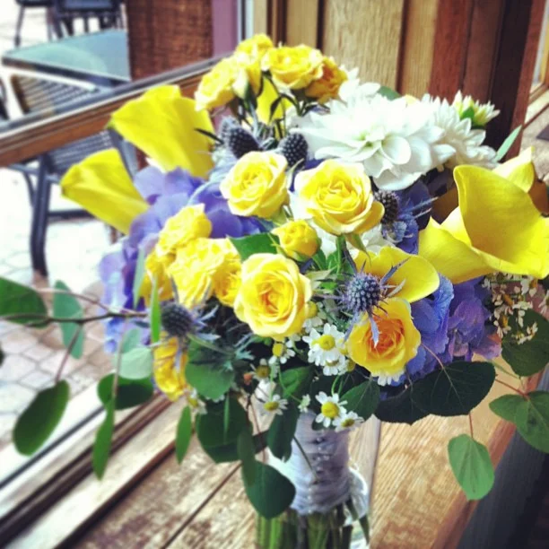 Janet's Bouquet // Hydrangea, thistle, spray roses, dahlia, calla lilies, fever few and millet. #breck #breckweddings #florist