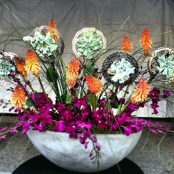 Custom piece for today's bike race. Look close and you'll see bike parts, flowers and succulents in a concrete container.