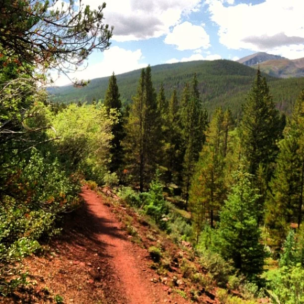 A bit of red dirt here. A 14er in the distance.
