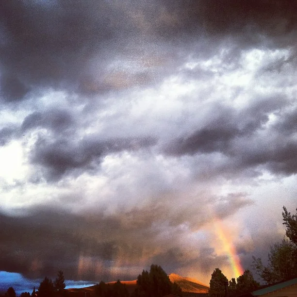 Streaks of rain and rainbow next to Mt. Baldy.