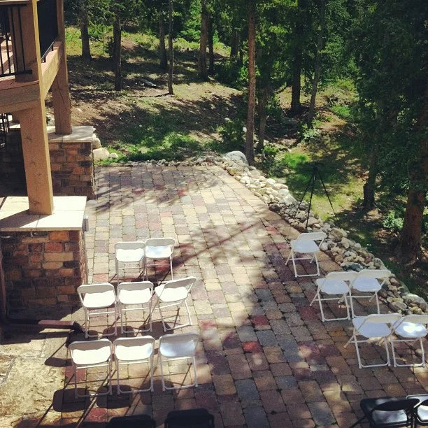 The back patio is being used for today's outdoor ceremony. // #breckwedding #homerental