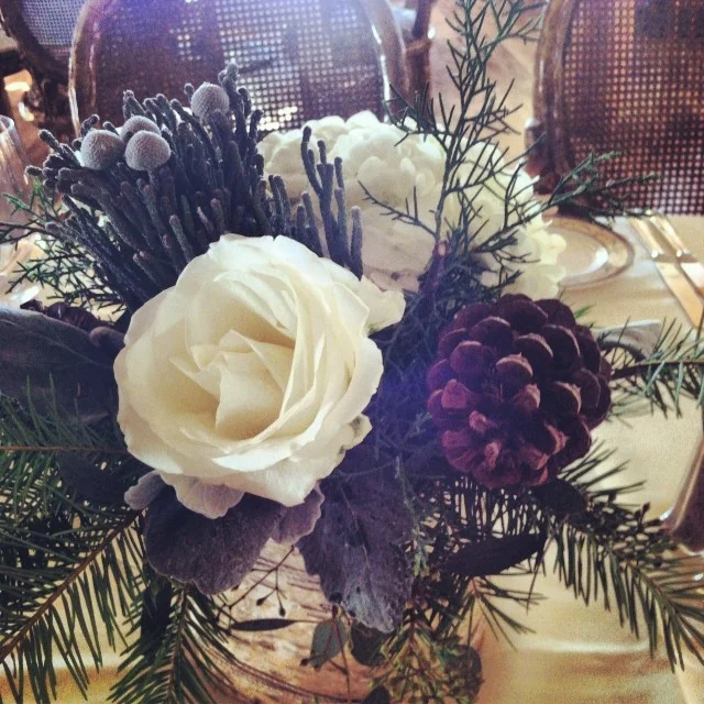 Centerpieces being placed on tables for tonight's wedding reception. // #keystonecolorado #keystoneweddings