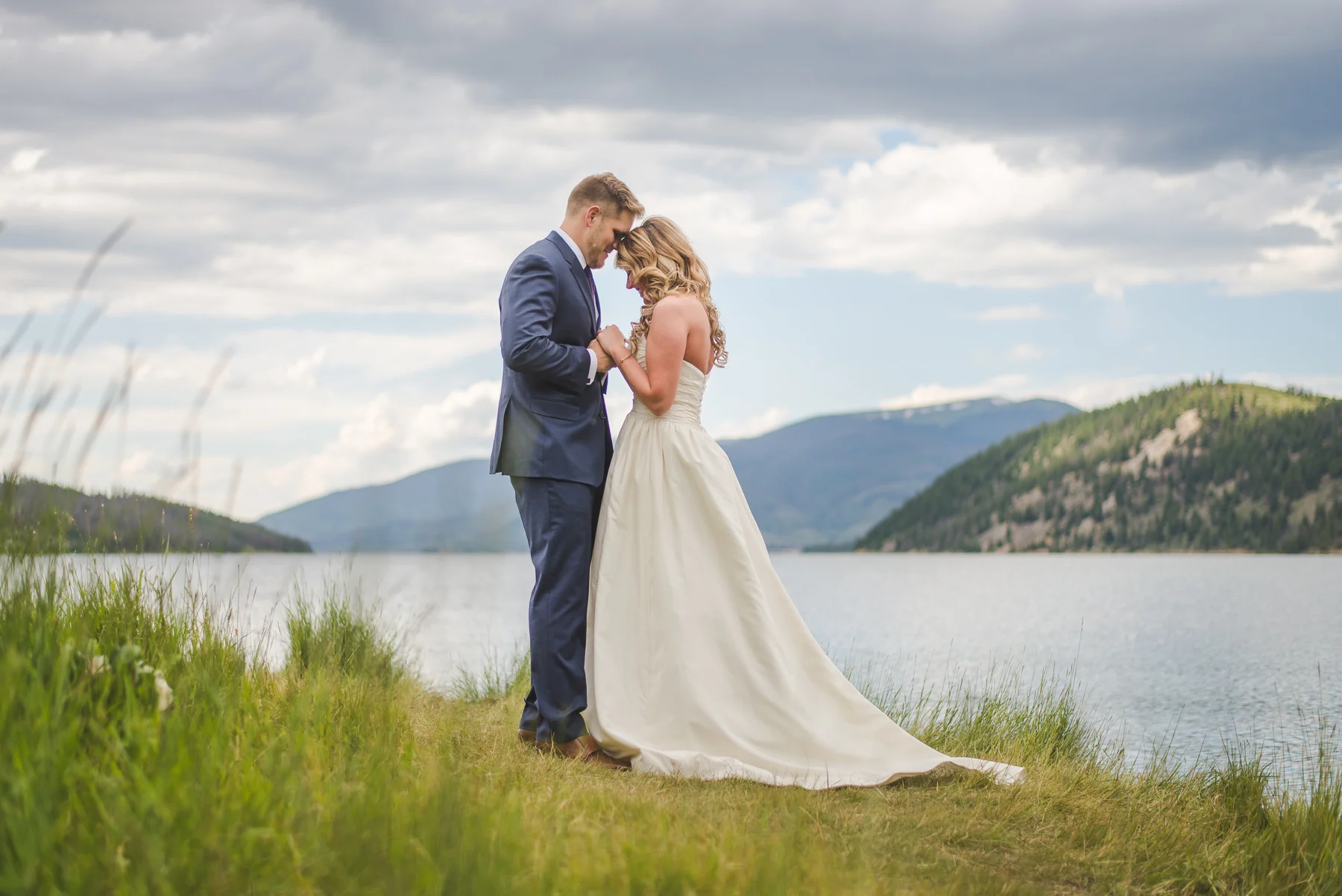 colorado bride and groom elopement prayer by lake dillon | summit mountain weddings