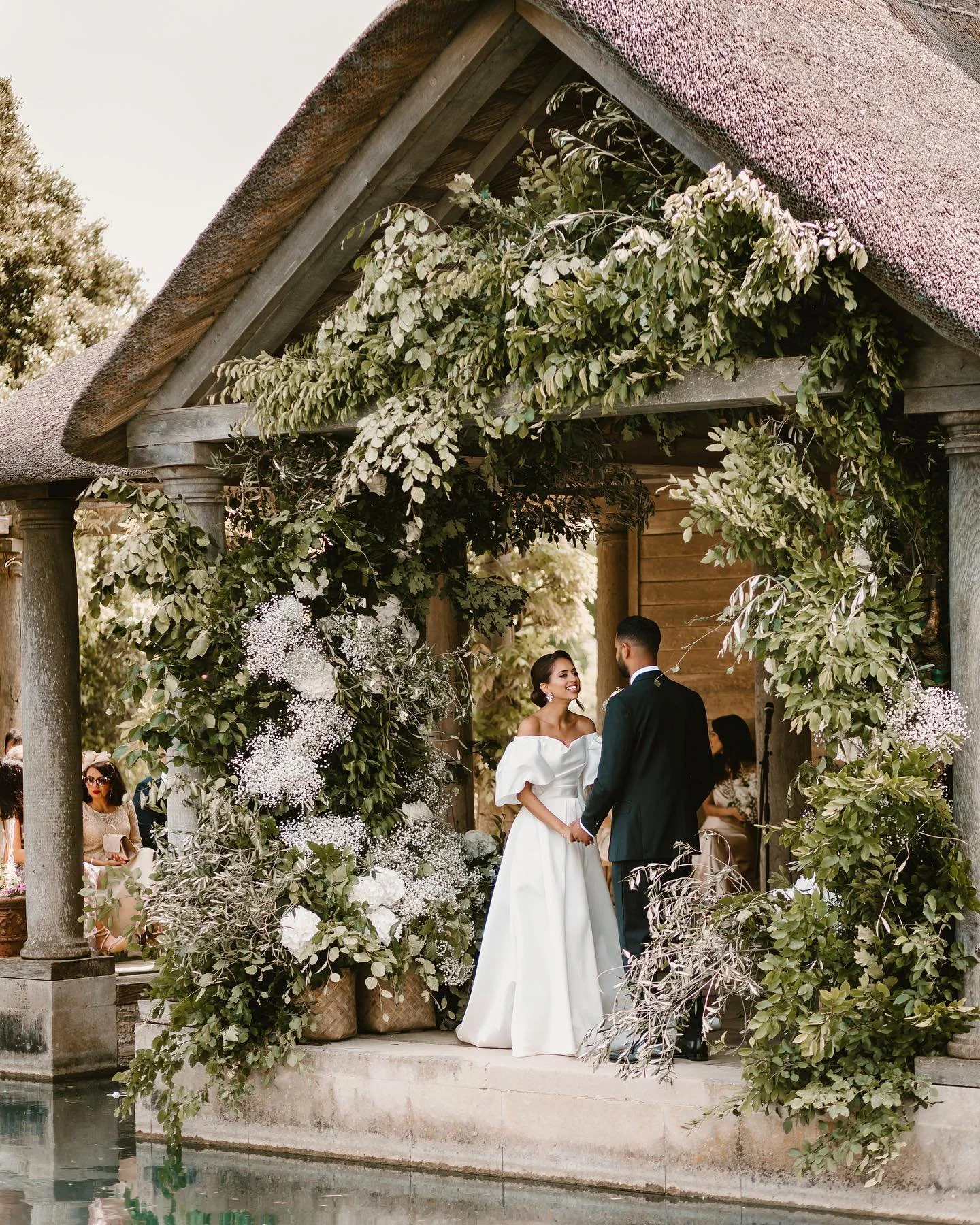 Dreaming of sun-kissed ceremonies surrounded by beautiful blooms 🌿 Spectacular work by @emmasoulsby 

Venue @euridge_ 
Planner @ivoryeventsandweddings @thehappybride.co 
Florist @emmasoulsby 
Dress @suzanneneville 
Make up @christinaouloupimua 
Hair