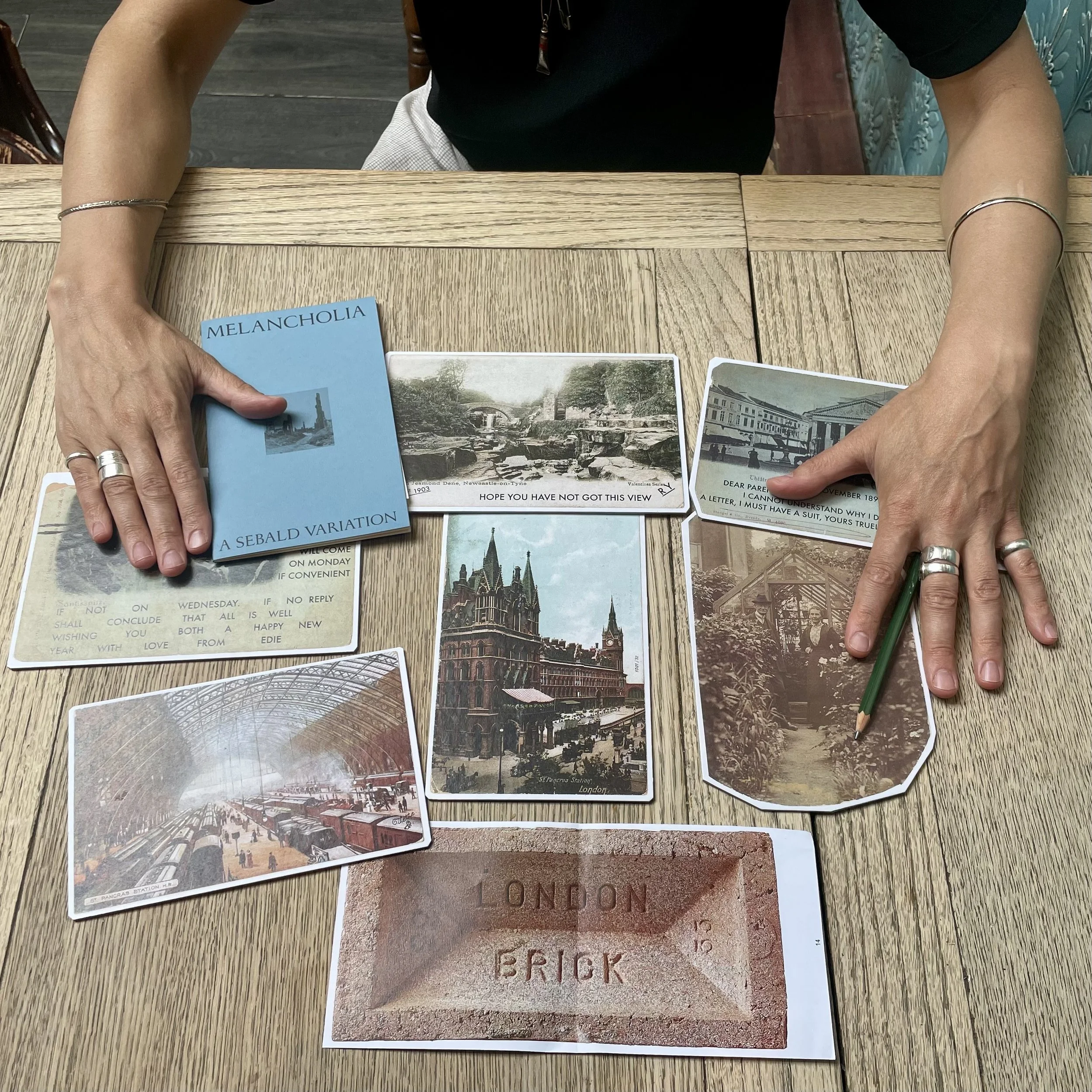 Hands table postcards image.jpeg