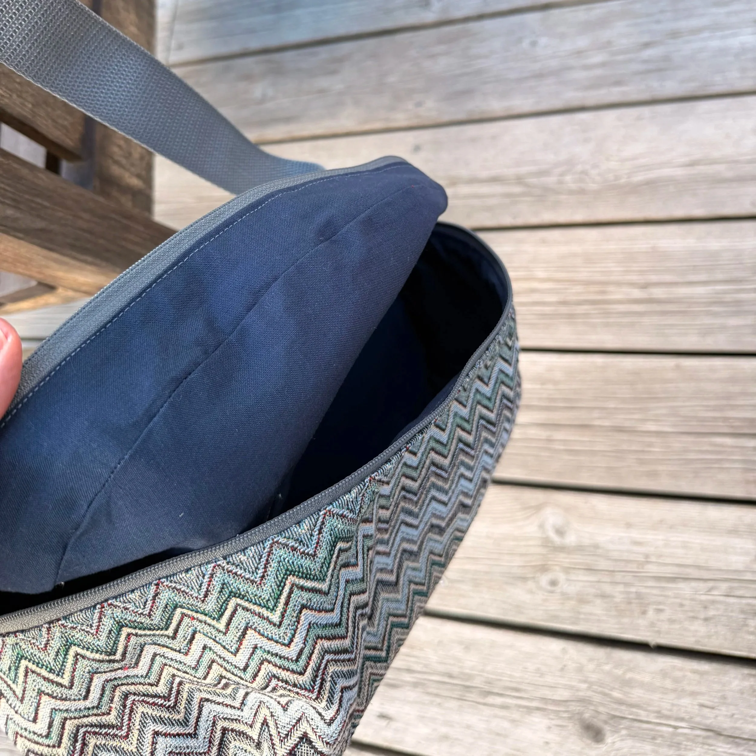 Open top-down view of the Gobelin sling bag highlighting the soft cotton lining .