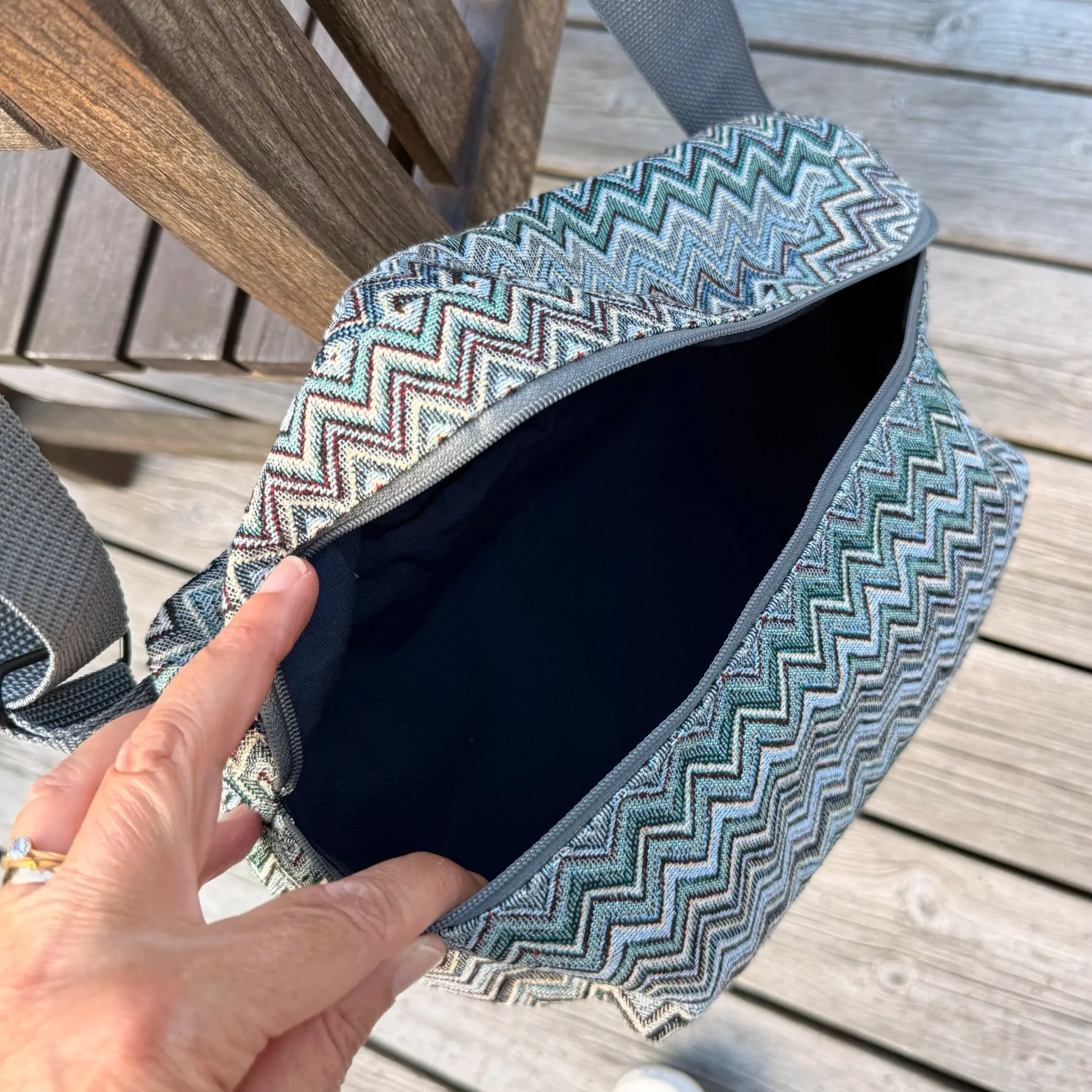 Open top-down view of the Gobelin sling bag highlighting the spacious interior.