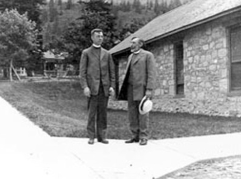 Clergy standing outside St. John's in the early 20th century.