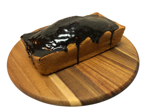 Panqué artesanal de naranja con ganache de chocolate, ideal para acompañar el café. Producto exclusivo de Bislee Pastelería.