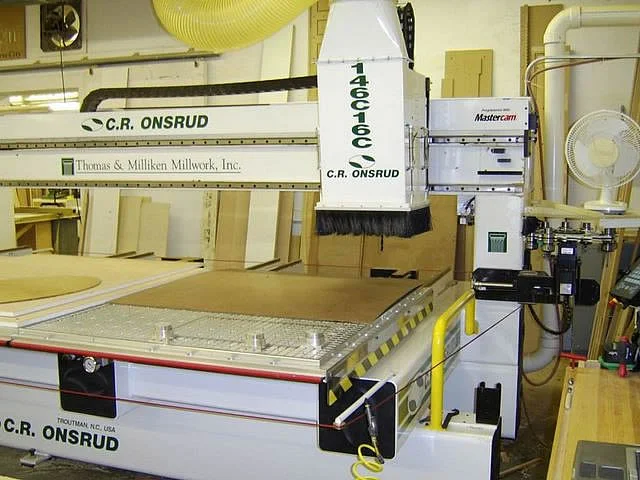 ONSRUD 5’ X 12’ CNC ROUTERThis high speed computerized router made in North Carolina allows us to cut curves and irregular shapes from autocad drawings. It selects its own tools and cleans up after itself. A vacuum lift permits large work to be lift…