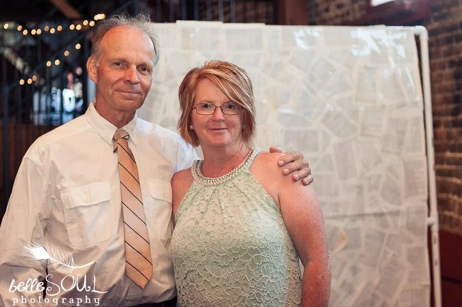 This lovely photo was taken by Bellesoul Photography at our son’s wedding… right after I hit my head hard on a brick pillar. We were dancing and he swung me around, neither of us noticed the pillar beforehand, lols.