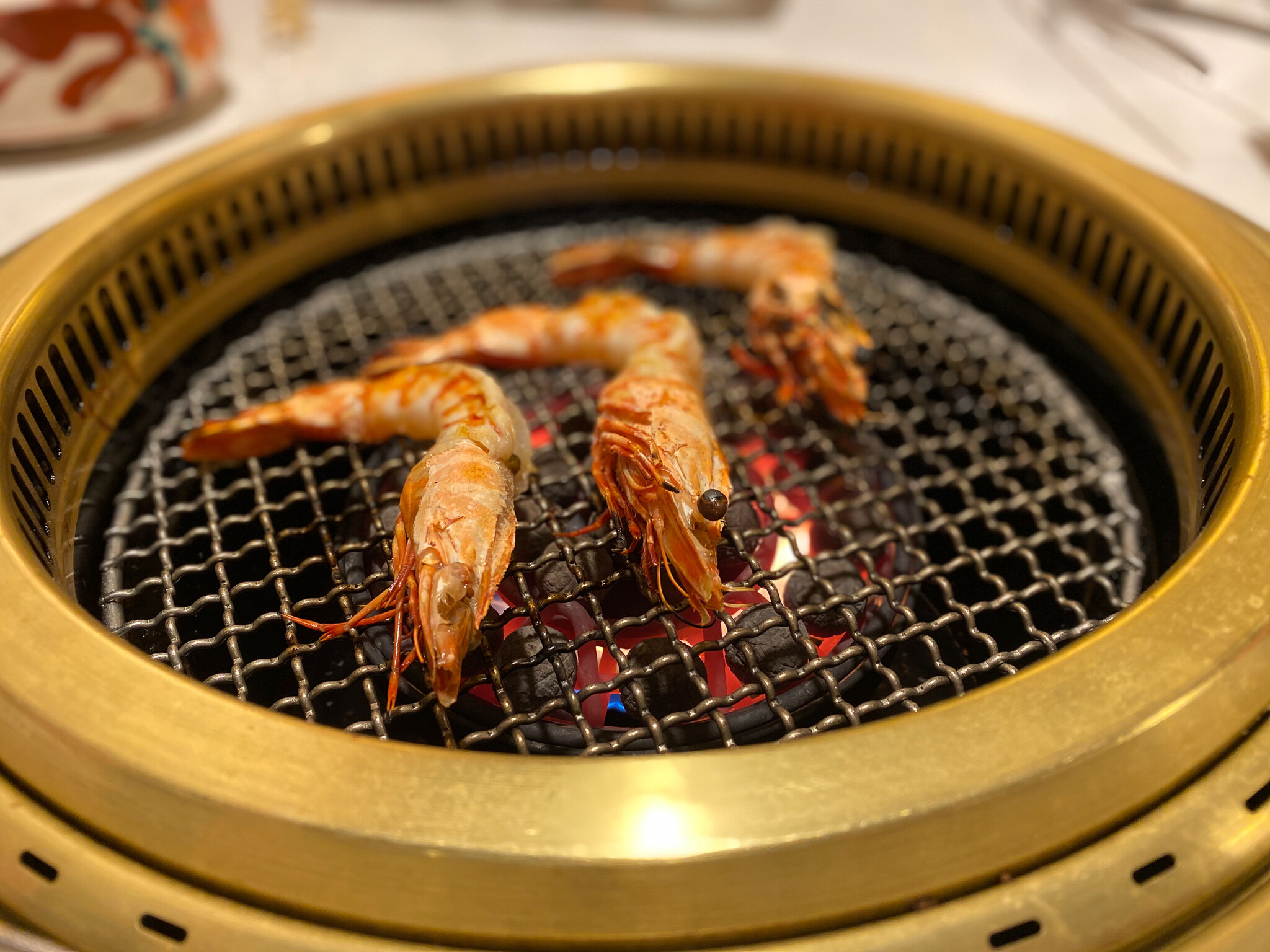 Prawns Shrimp on Japanese BBQ grill yakiniku restaurant