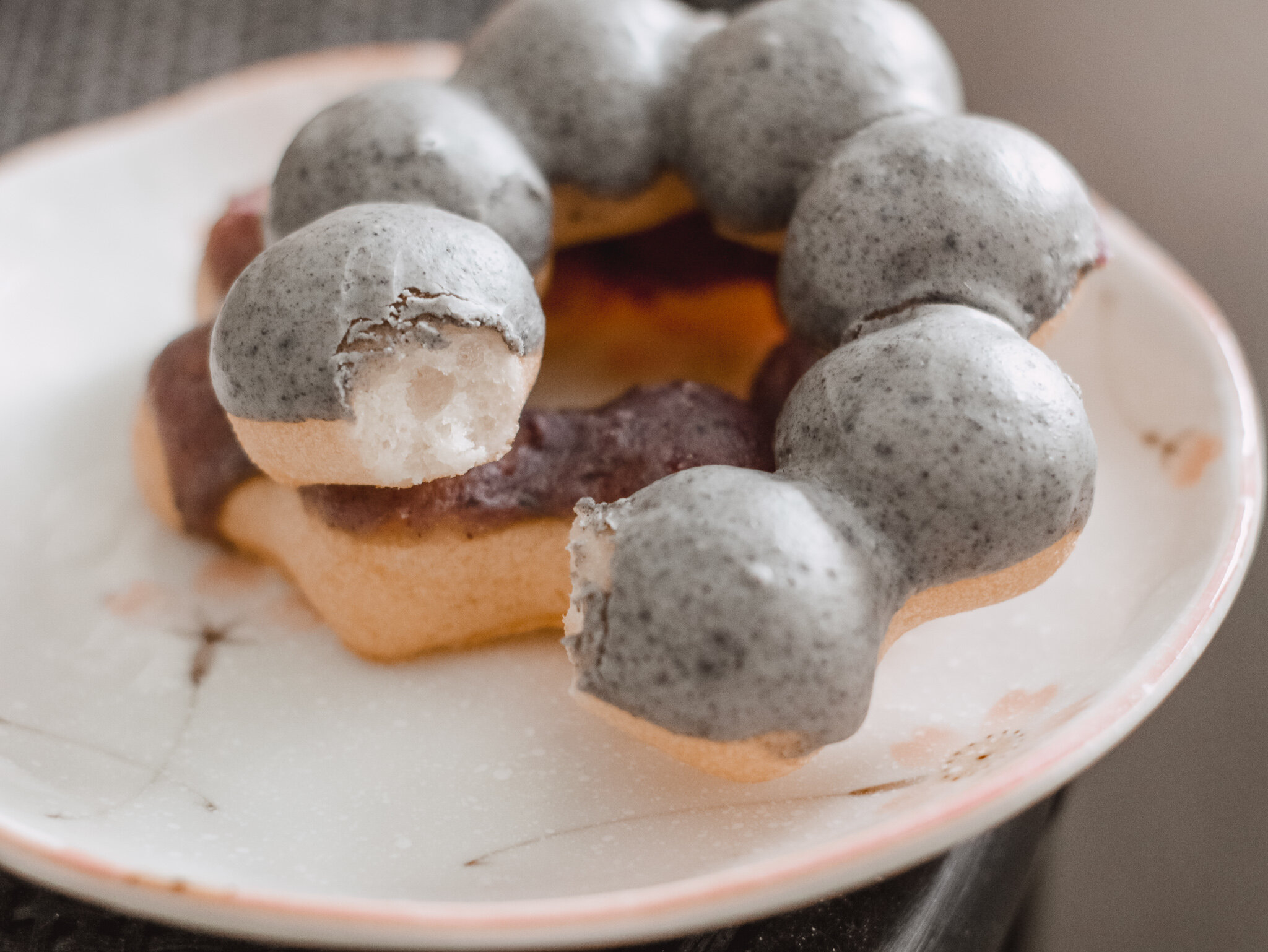 Bitten into Modo Hawaii Black Sesame Mochi Donut.jpg