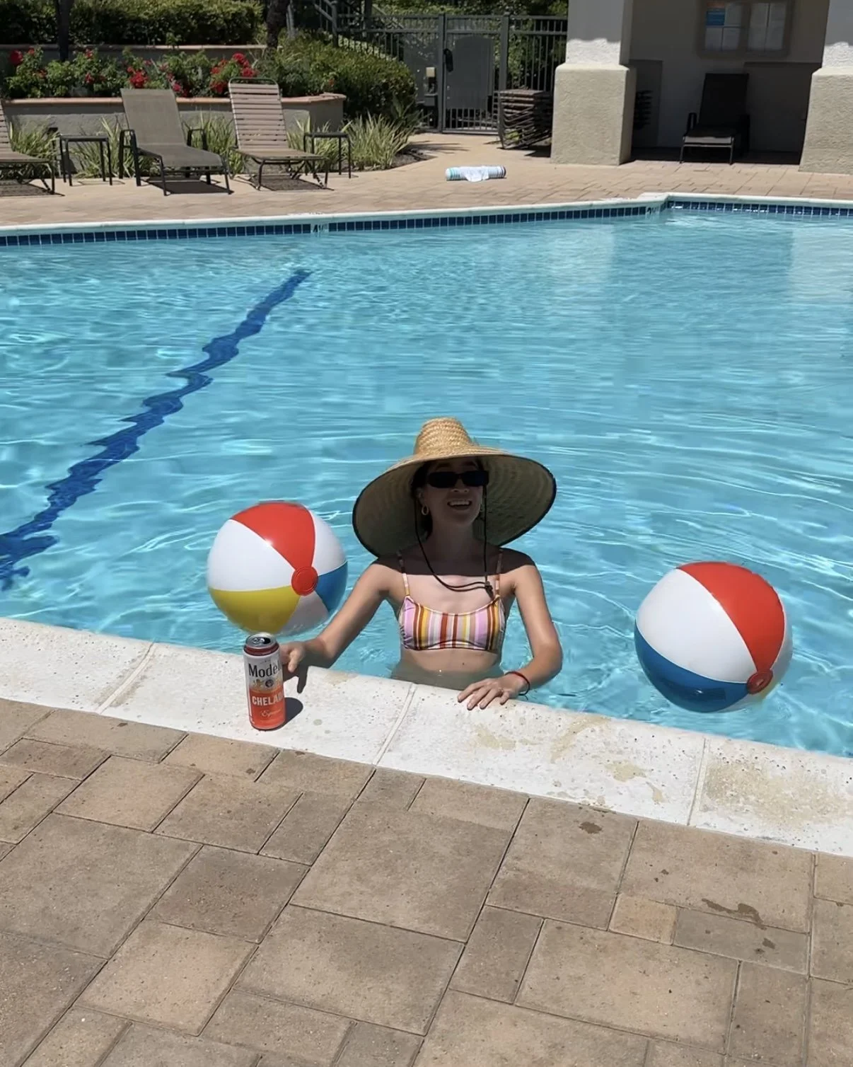 wearing summer straw hat pool.- Amanda N Hammond.jpg