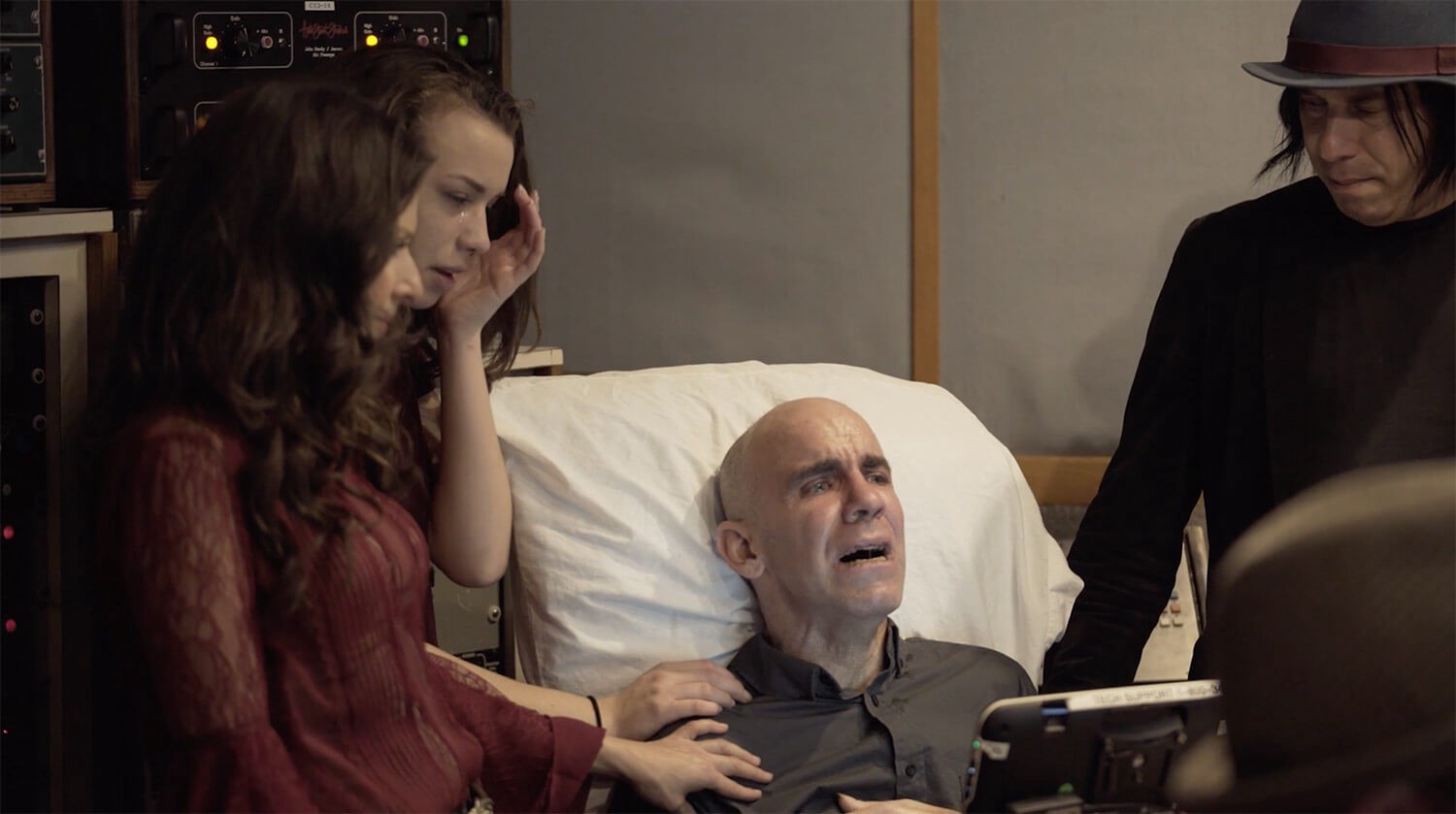Essence, Nicole, Bernie, and Roger Rocha (left to right) in the hospital