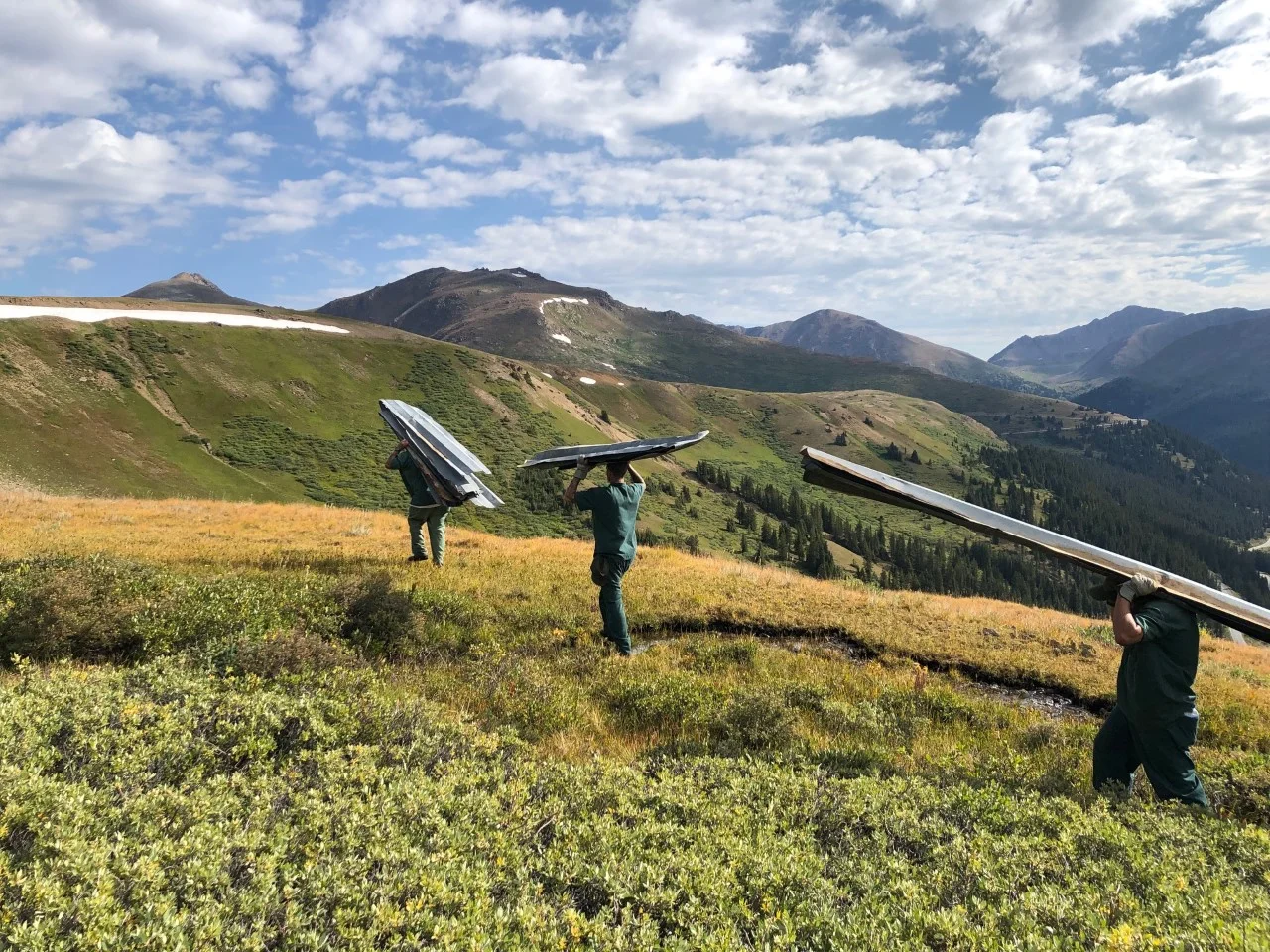 Removing discarded snow fence—12’ aluminum panels—from the Mountain Boy area of the Collegiate Peaks Wilderness