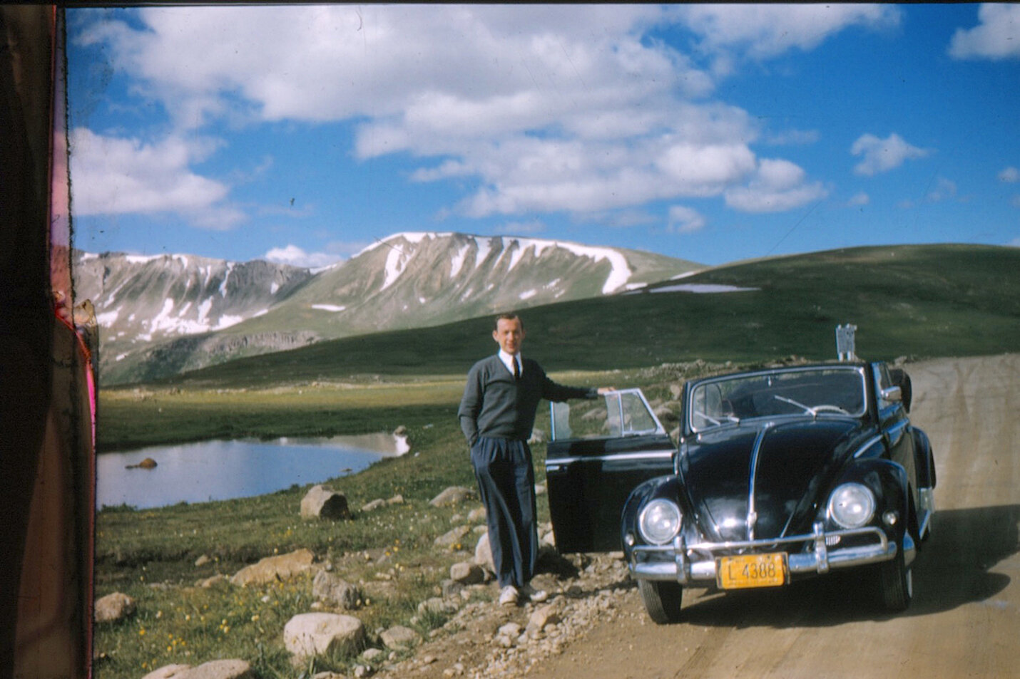 Papa on Pass with VW 1957  Wisc. Lic. Plate Looking at Mt. Boy copy 2.jpg
