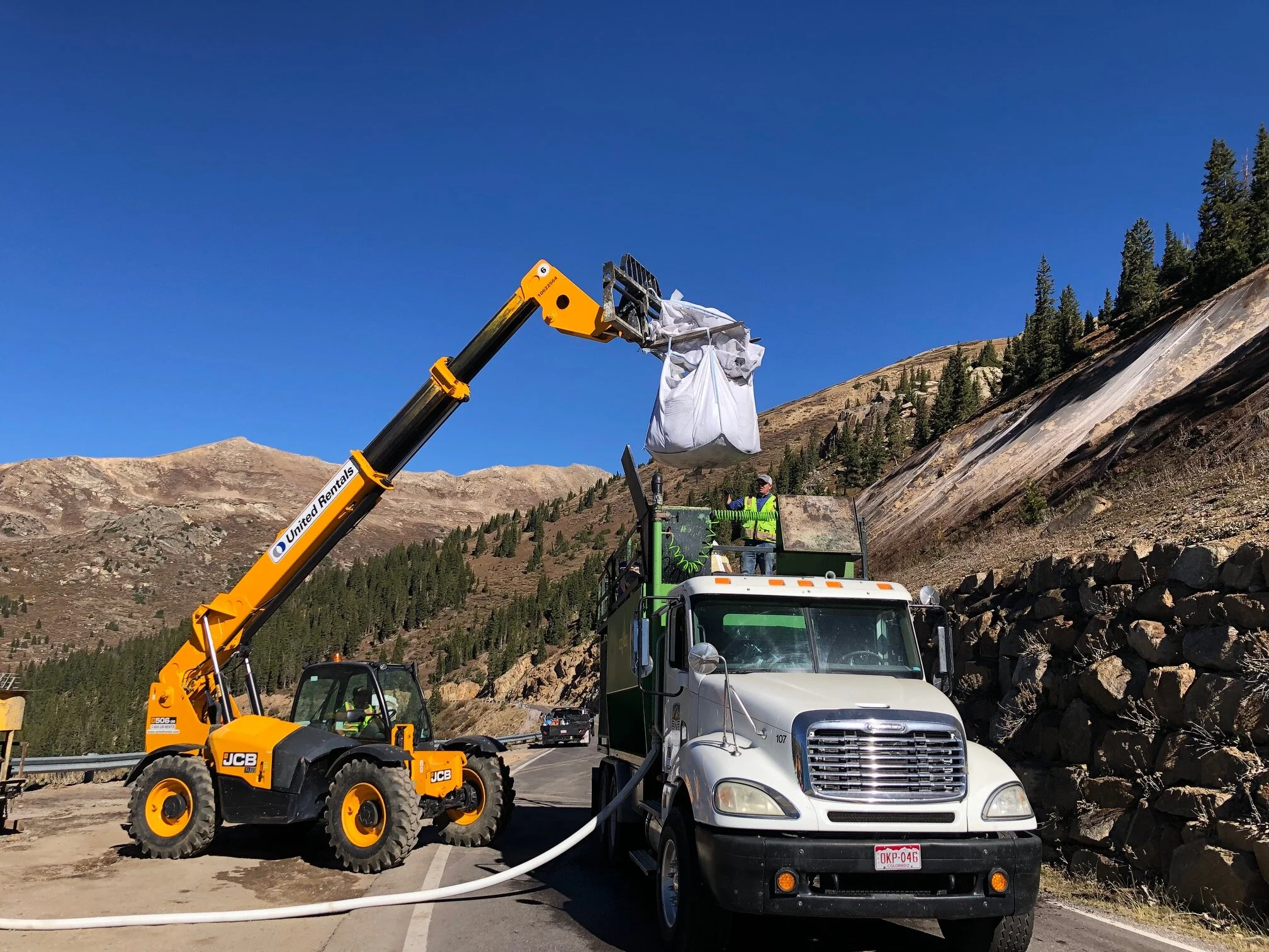 Loading materials to mix with water for spraying