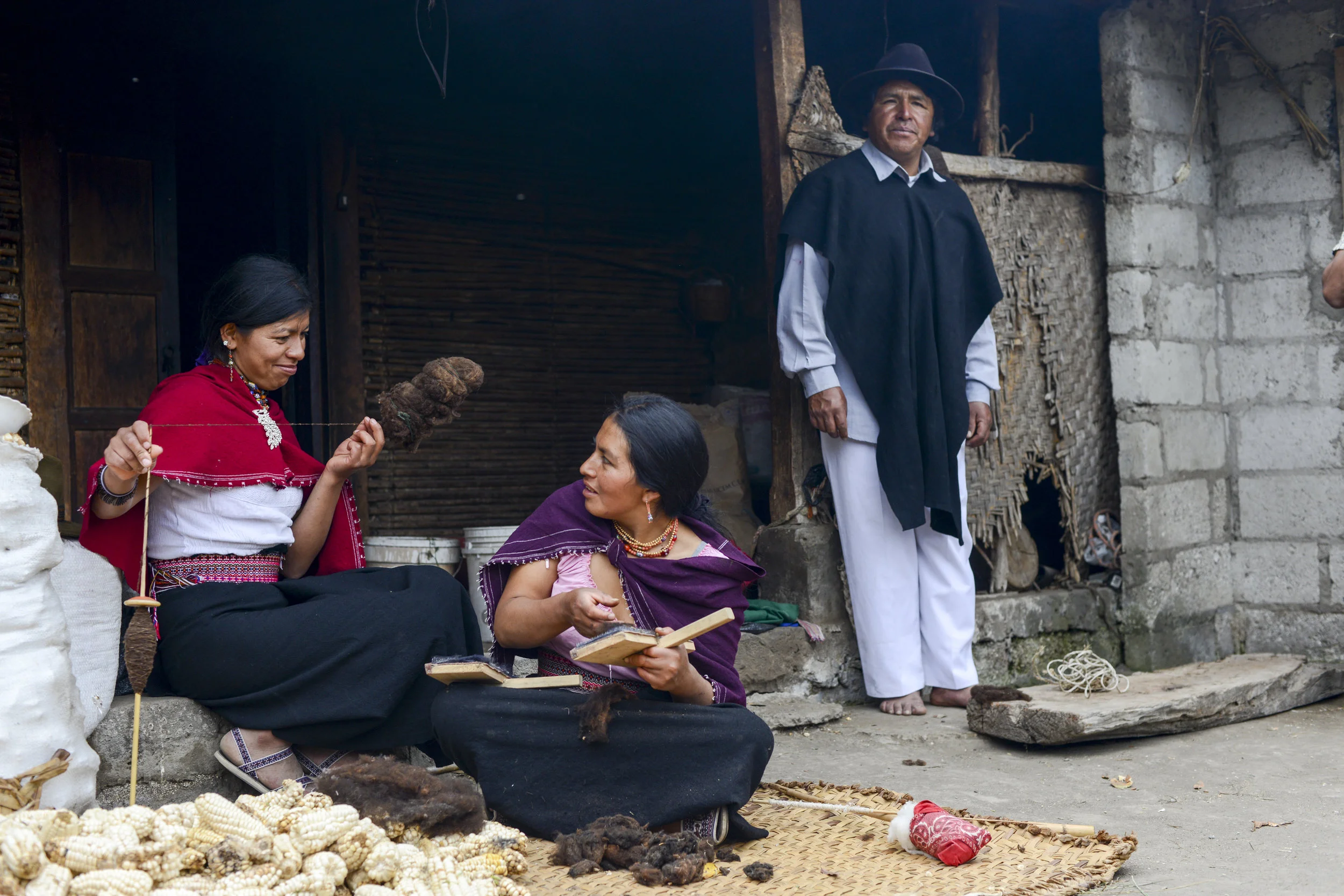  Village of Salasaka, Ecuador. Women make useable yarn from harvested sheep's wool that will later be made into traditional ponchos.&nbsp; 