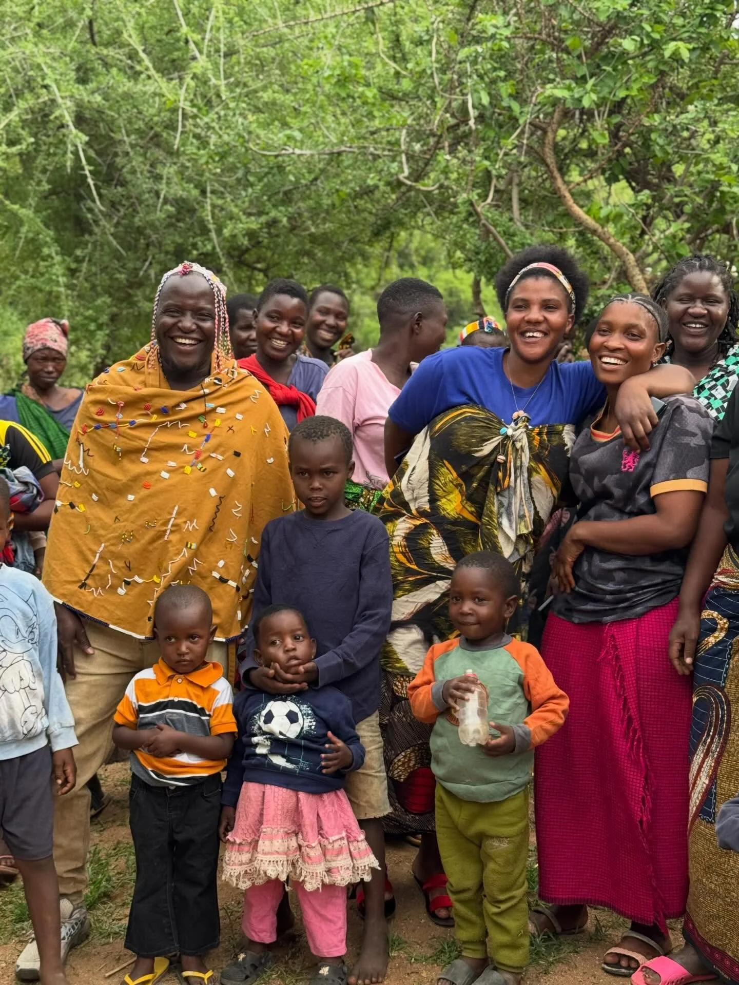 After weeks of journeying across Hadza regions on behalf of Meleka projects, our chairperson Endeko returns home. This is Mongo wa Mono village in the Yaeda Valley region where he was born and still lives today. He is welcomed back by song, dance, an
